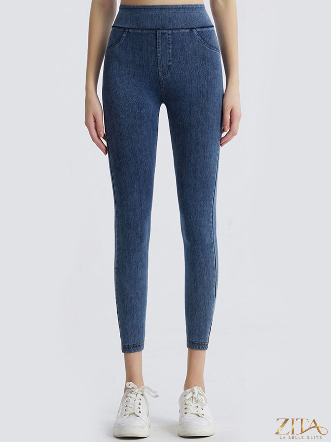Black wide waistband sports leggings by Trendsi, showing a close-up of the high-rise elastic waistband and stretchy fabric.
