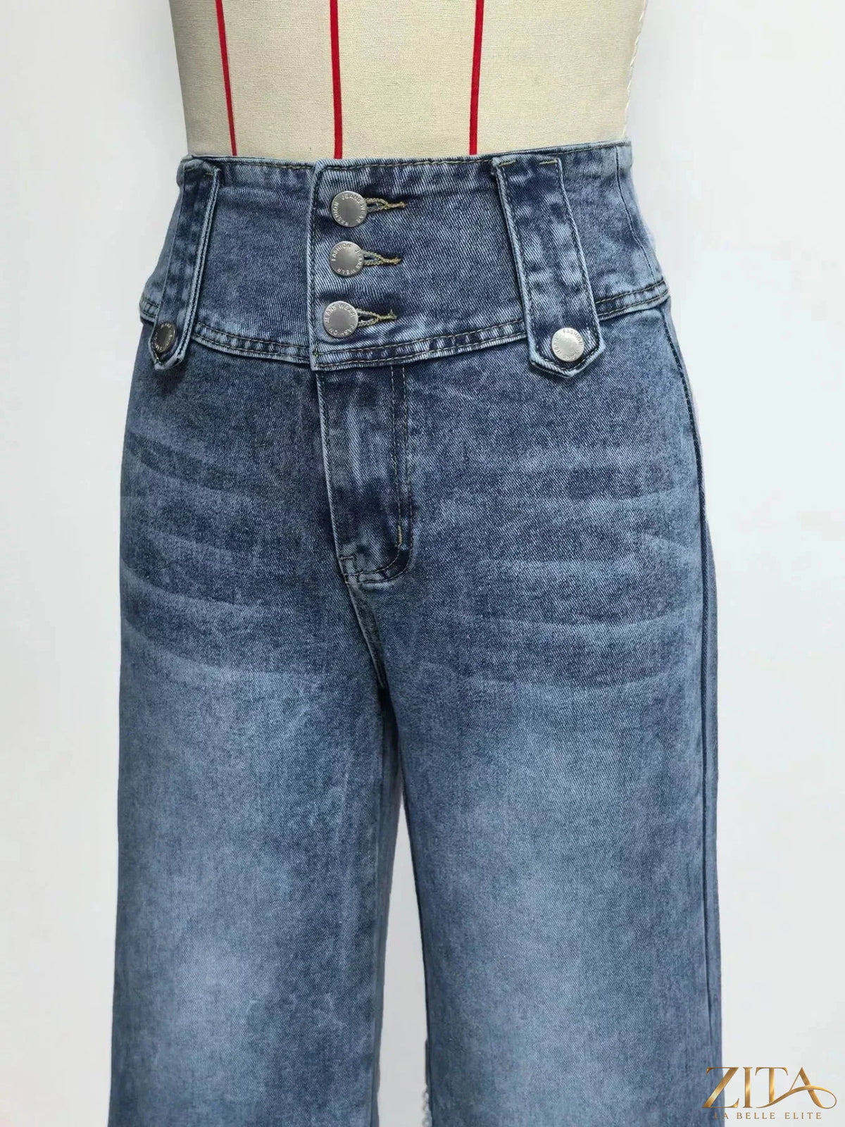 High waist wide leg jeans with button decor by Zita La Belle Elite, showcasing a stylish denim look and relaxed fit.