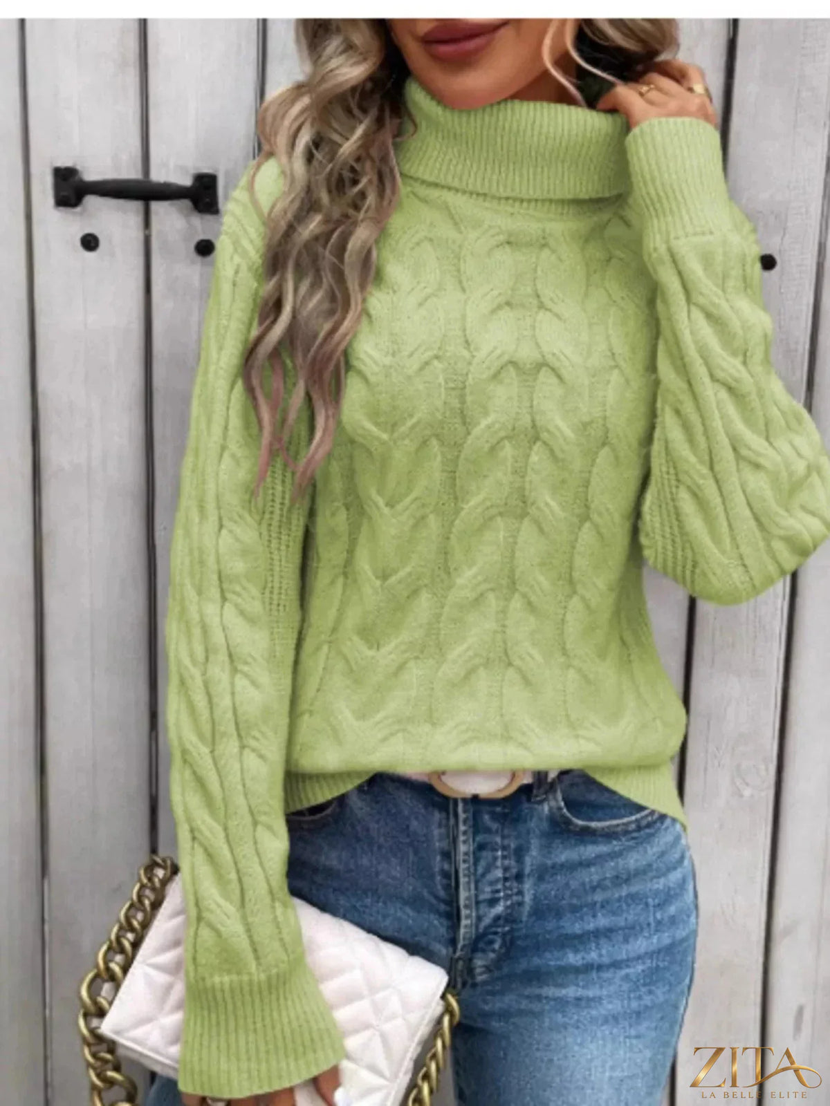 Zita La Belle Elite cable-knit turtleneck sweater in cozy knit fabric, featuring a high neckline and textured pattern.
