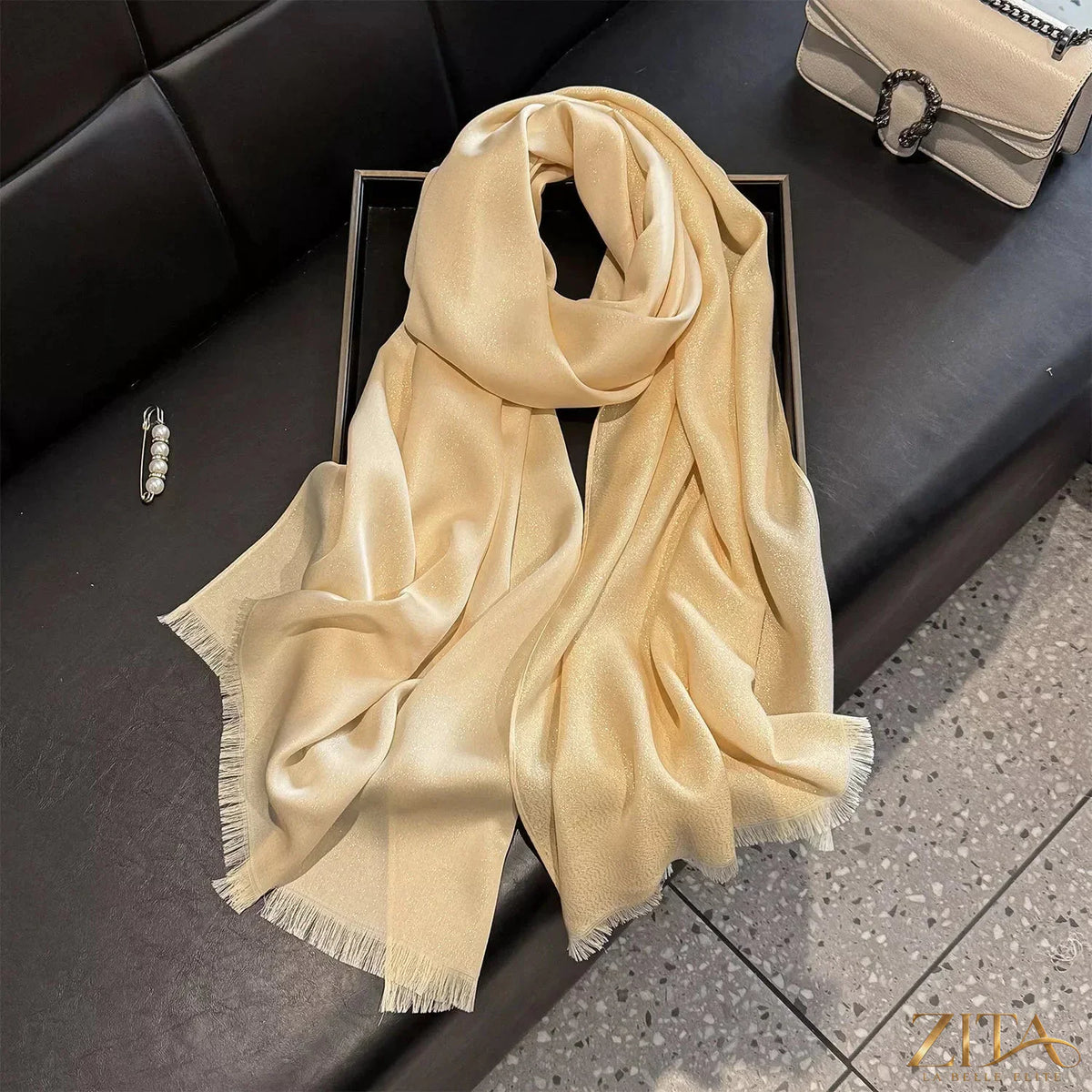 Raw hem scarf from Trendsi featuring soft, lightweight fabric with frayed edges, perfect for stylish layering or casual wear.