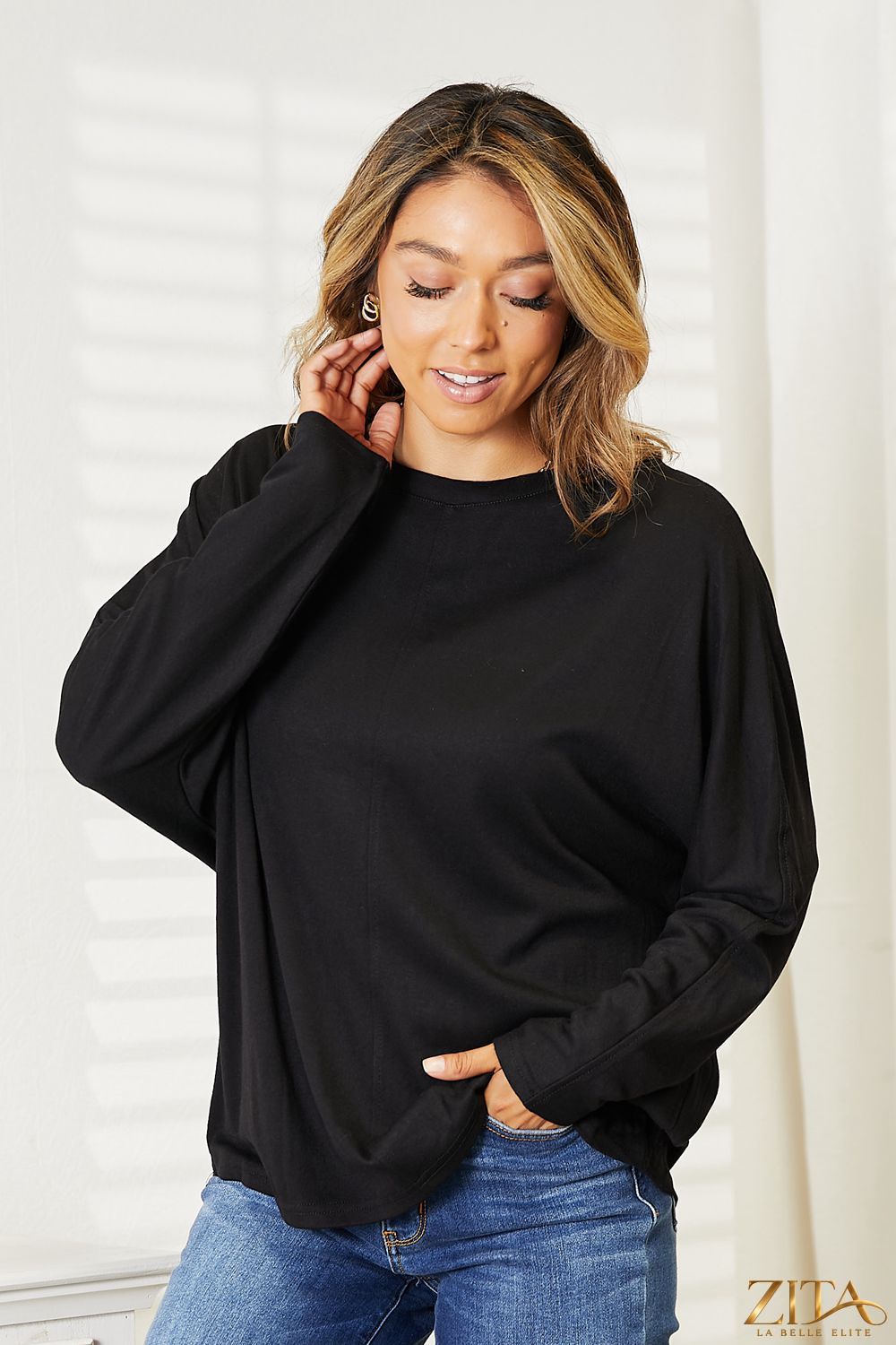 Zita La Belle Elite Double Take seam detail round neck long sleeve top in a neutral color, close-up of fabric and seam design.