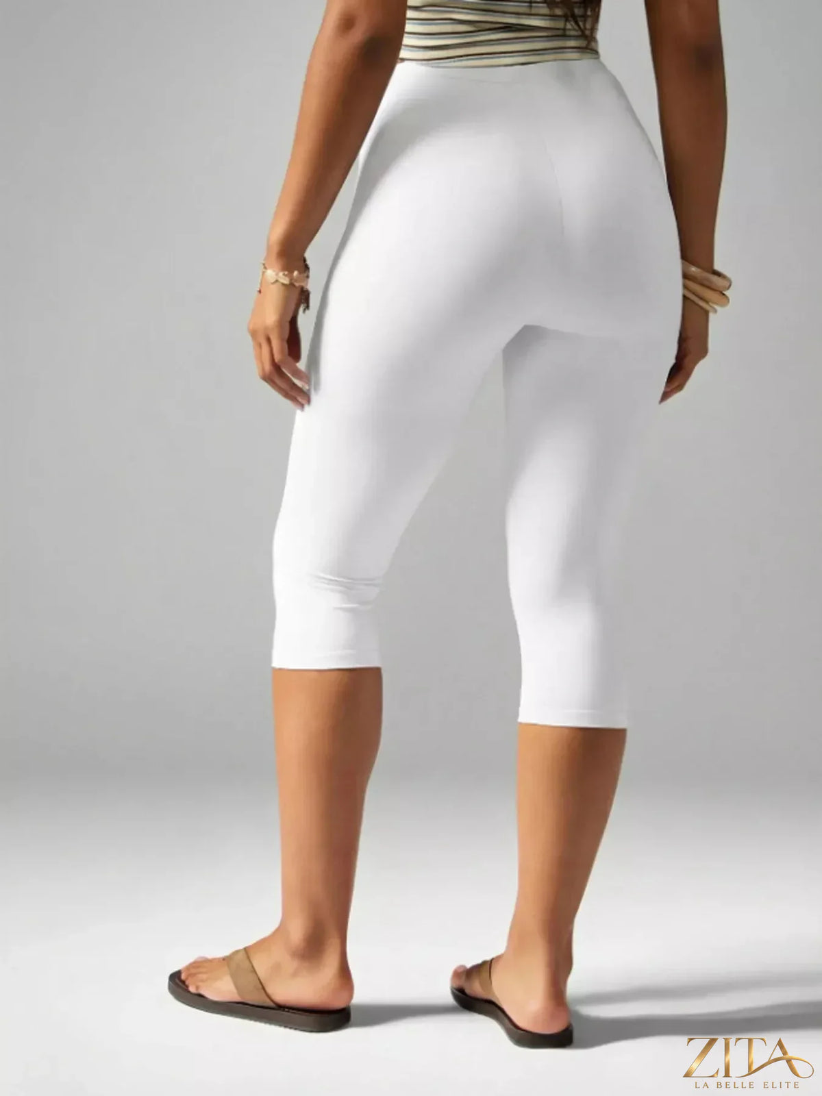 High-waisted Zita La Belle Elite active capri leggings displayed on a model, showcasing their fit and stretchy fabric for workout wear.