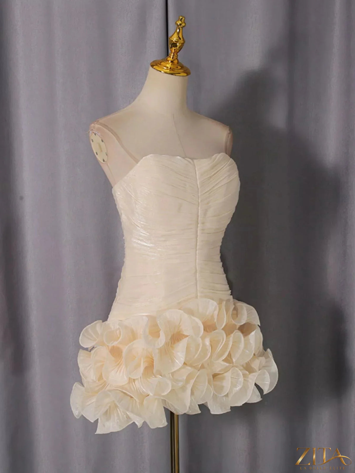 Strapless ruffle ruched mini dress by Trendsi, featuring a fitted bodice with layered ruffle details and a short hemline.