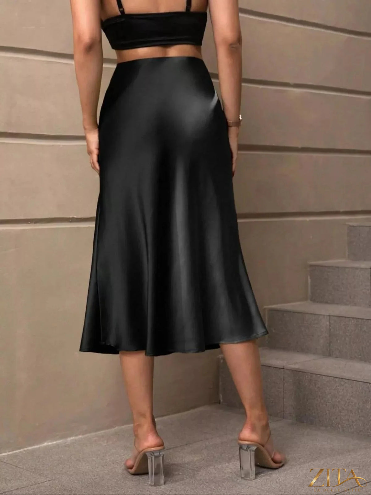 Satin midi skirt by Trendsi featuring a sleek, smooth fabric, high waist, and elegant length for a stylish, feminine look