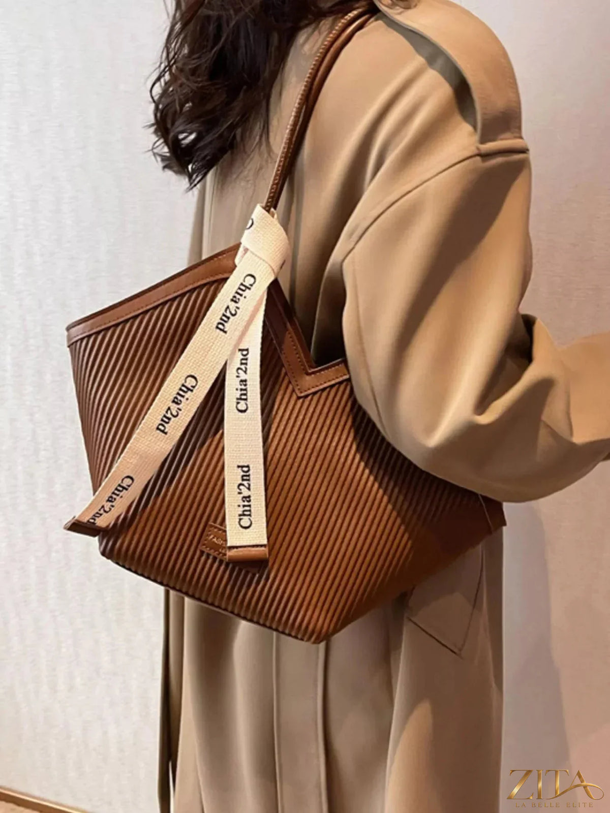 Zita La Belle Elite textured leather shoulder bag with a sleek design and top handle, showcasing its detailed craftsmanship.