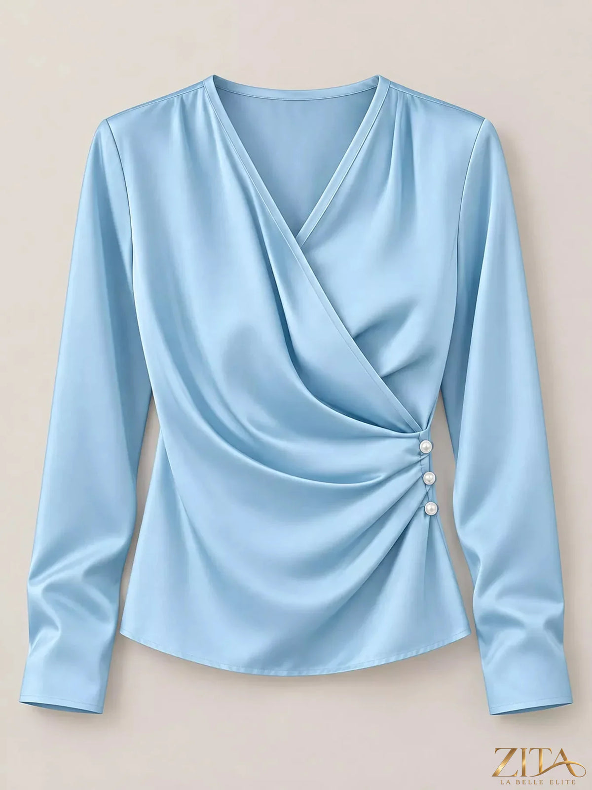 Zita La Belle Elite satin surplice long sleeve blouse with elegant draping and a V-neck design, displayed on a mannequin.