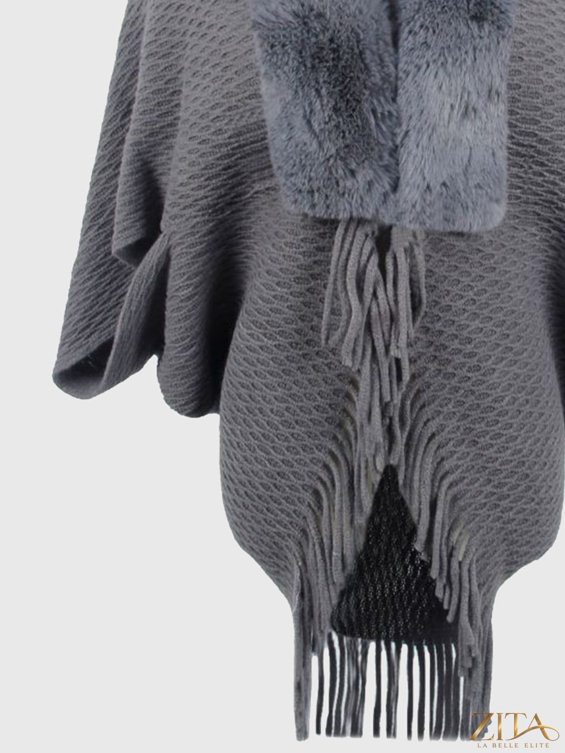 Open front fringe hem poncho by Trendsi featuring a stylish, flowing design with fringe details on the hem.