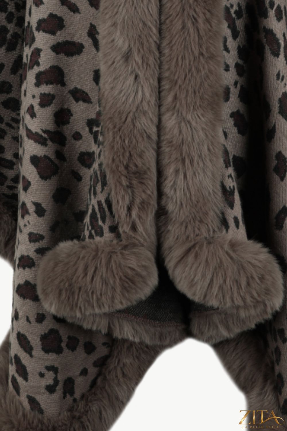 Leopard open front poncho by Trendsi featuring a stylish animal print and relaxed fit, draped over a neutral background.