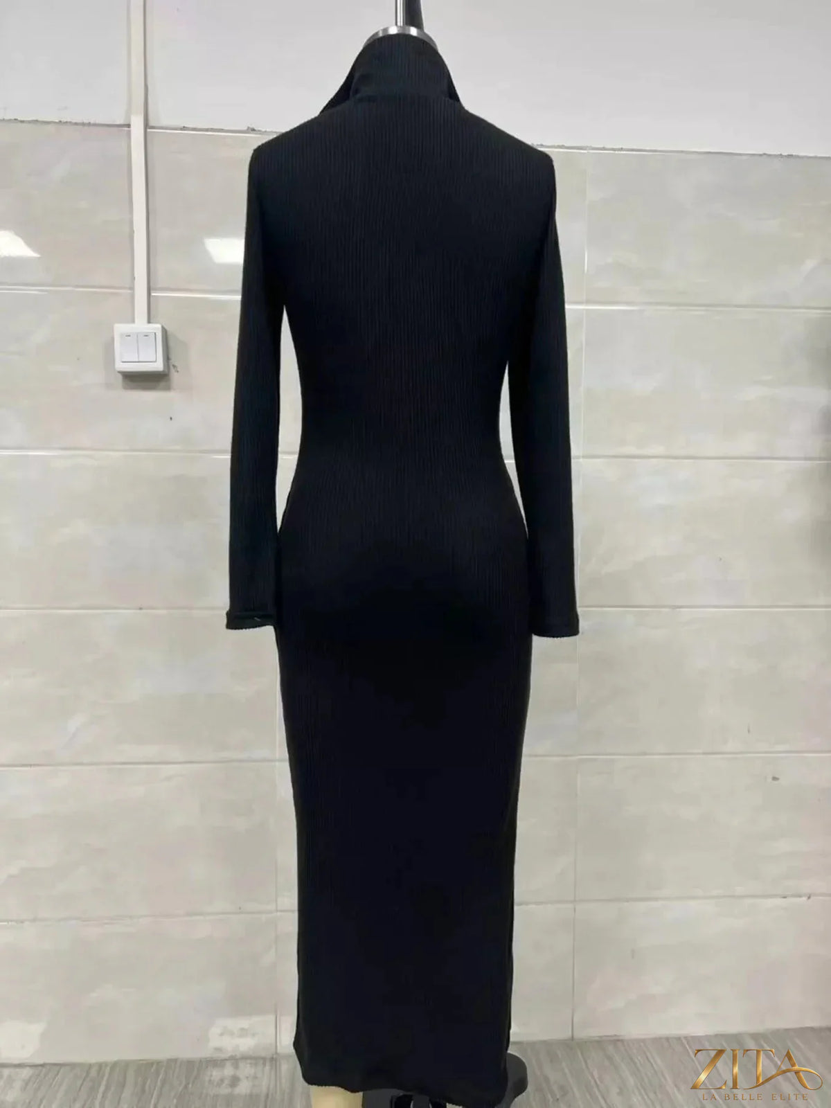 Ribbed knit V-neck sweater dress by Zita La Belle Elite, featuring a fitted silhouette and textured fabric in a cozy, stylish design.