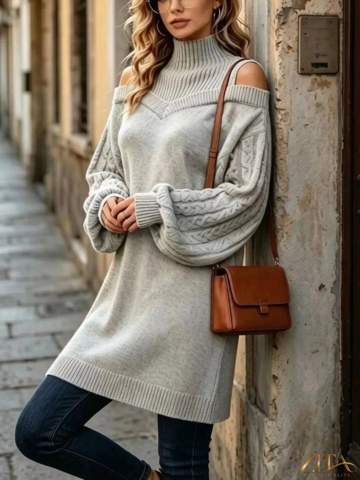 Plus size Zita La Belle Elite cold-shoulder cable knit turtleneck sweater with stylish cutouts and cozy design.
