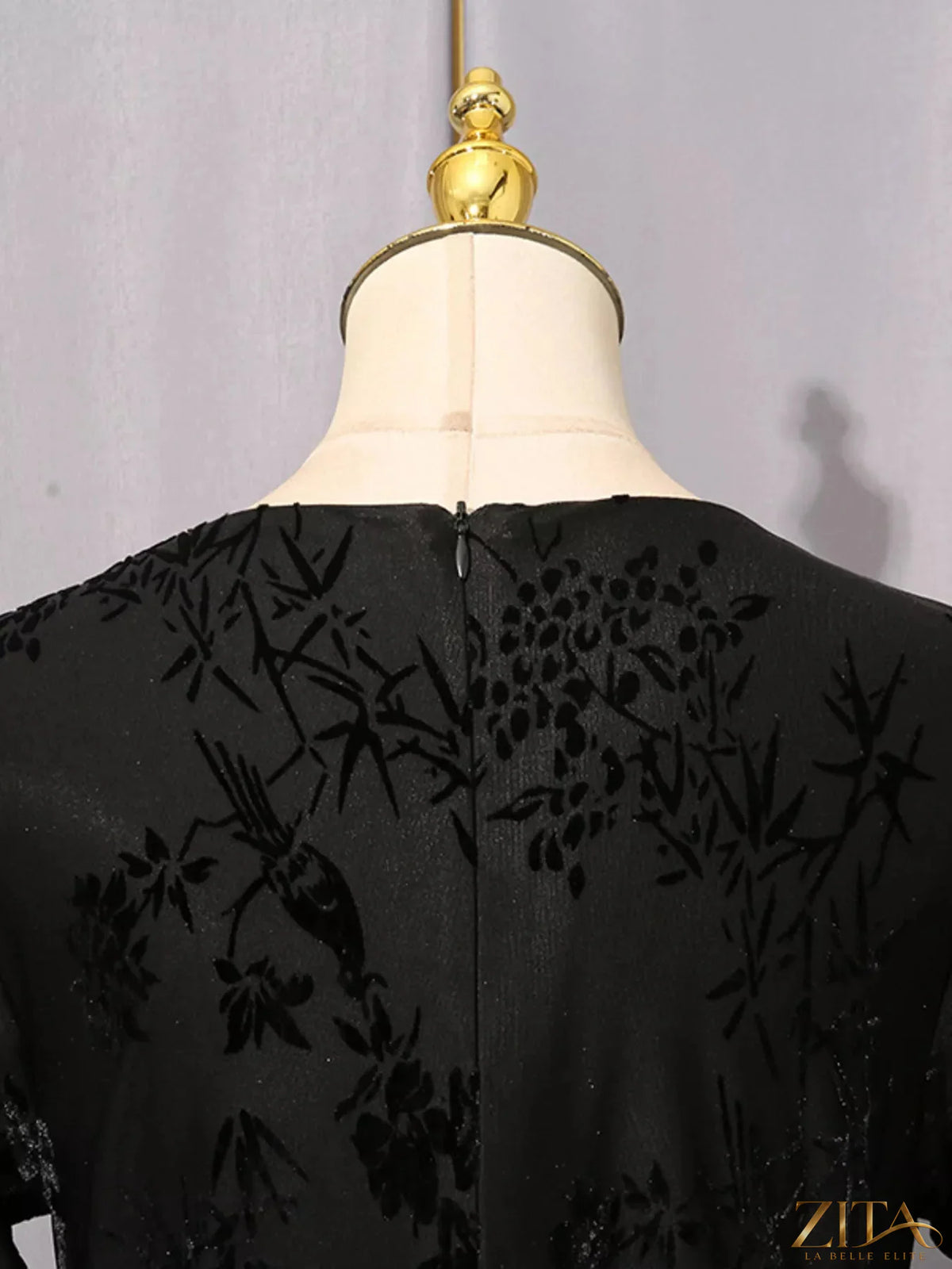 Black ruched long sleeve mini dress from Trendsi featuring a fitted silhouette and stylish design.