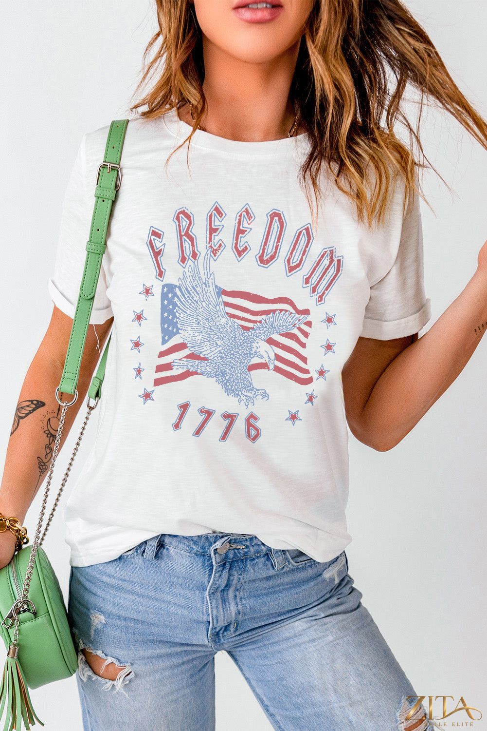 Freedom 1776 graphic T-shirt by Trendsi featuring a bold patriotic design on a casual cotton tee.