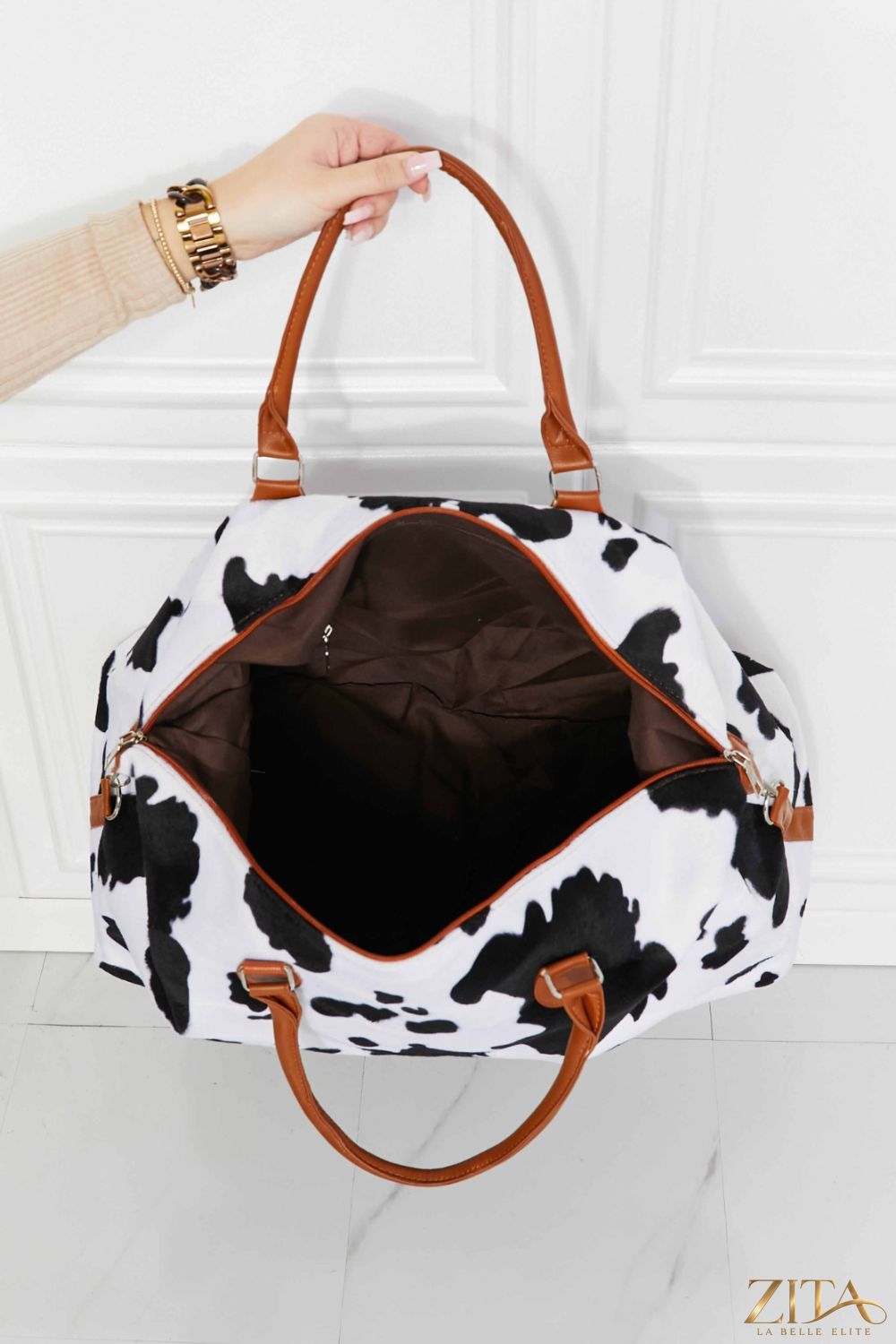 Animal print plush weekender bag by Zita La Belle Elite with soft fabric, spacious interior, and stylish animal pattern design.