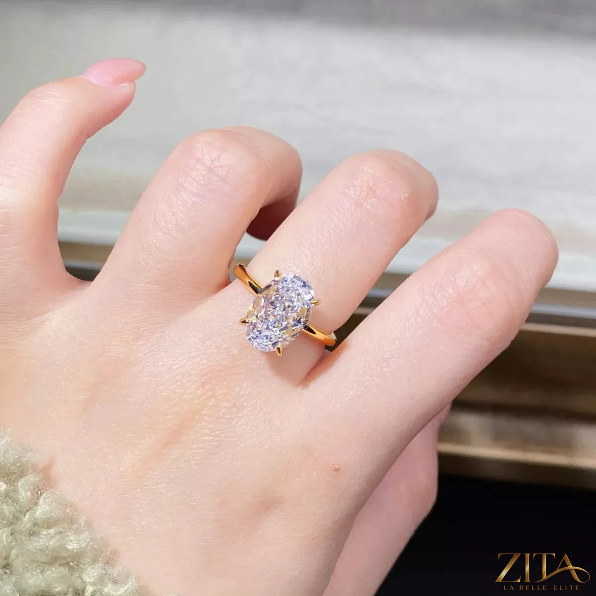 18K gold-plated zircon ring by Zita La Belle Elite with sparkling zircon stones and a sleek band design.