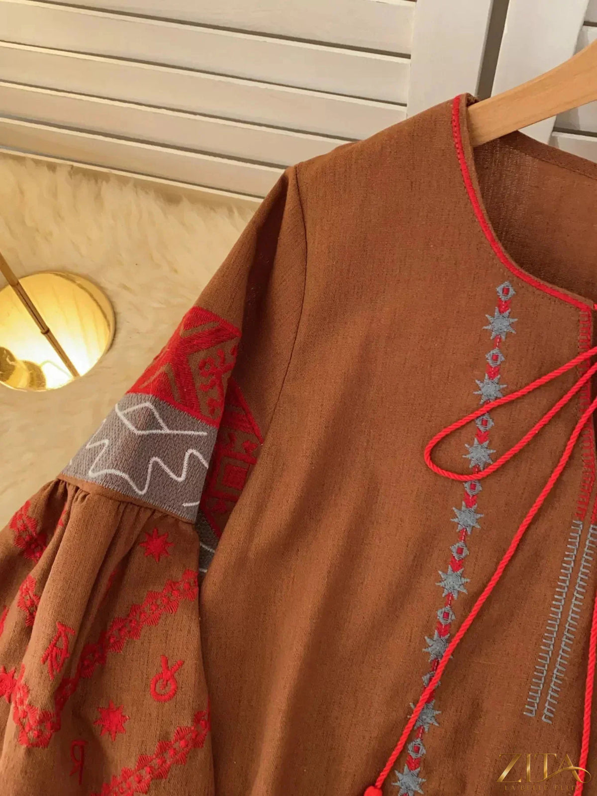 Embroidered tie neck blouse by Zita La Belle Elite featuring intricate embroidery and a stylish tie detail at the neckline.