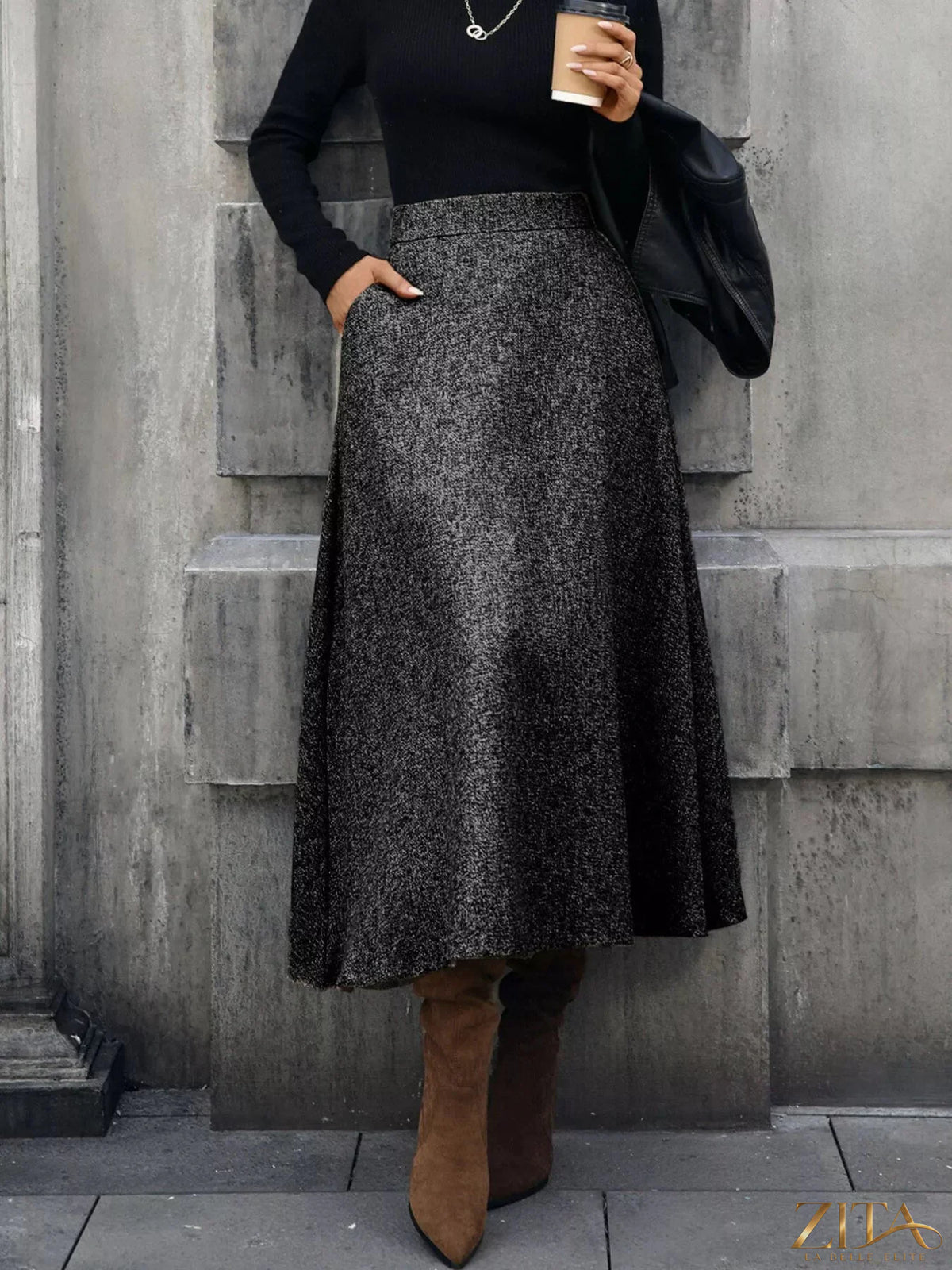 A-line midi skirt from Trendsi featuring a flowy silhouette in soft fabric, perfect for casual or dressy occasions.