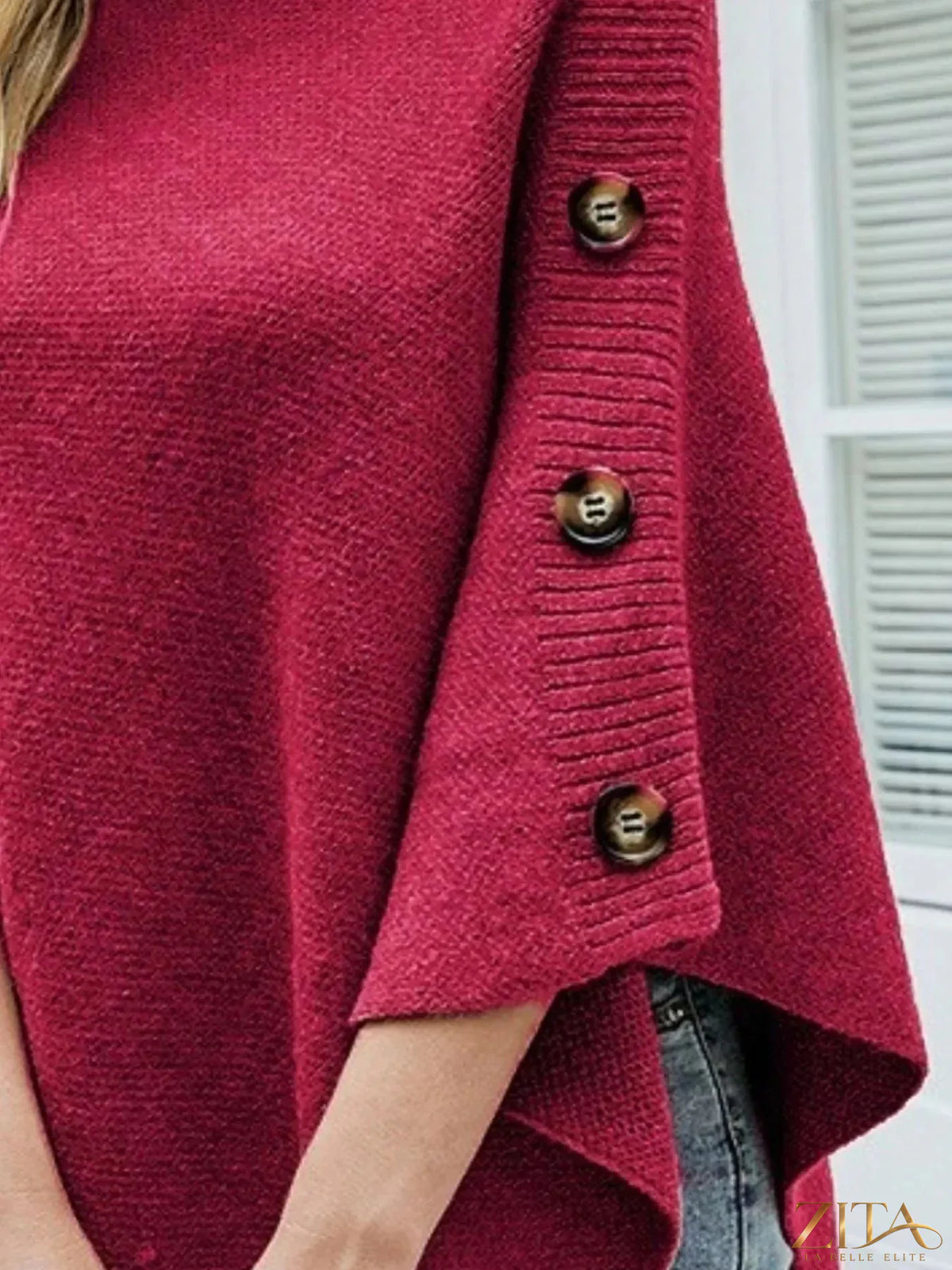 Zita La Belle Elite button-decor turtleneck poncho pullover in cozy knit fabric, featuring large buttons and a relaxed fit.
