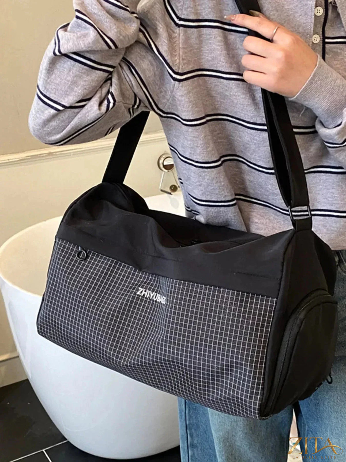 Zita La Belle Elite plaid Oxford cloth travel bag with leather accents, featuring sturdy handles and spacious interior for travel essentials.