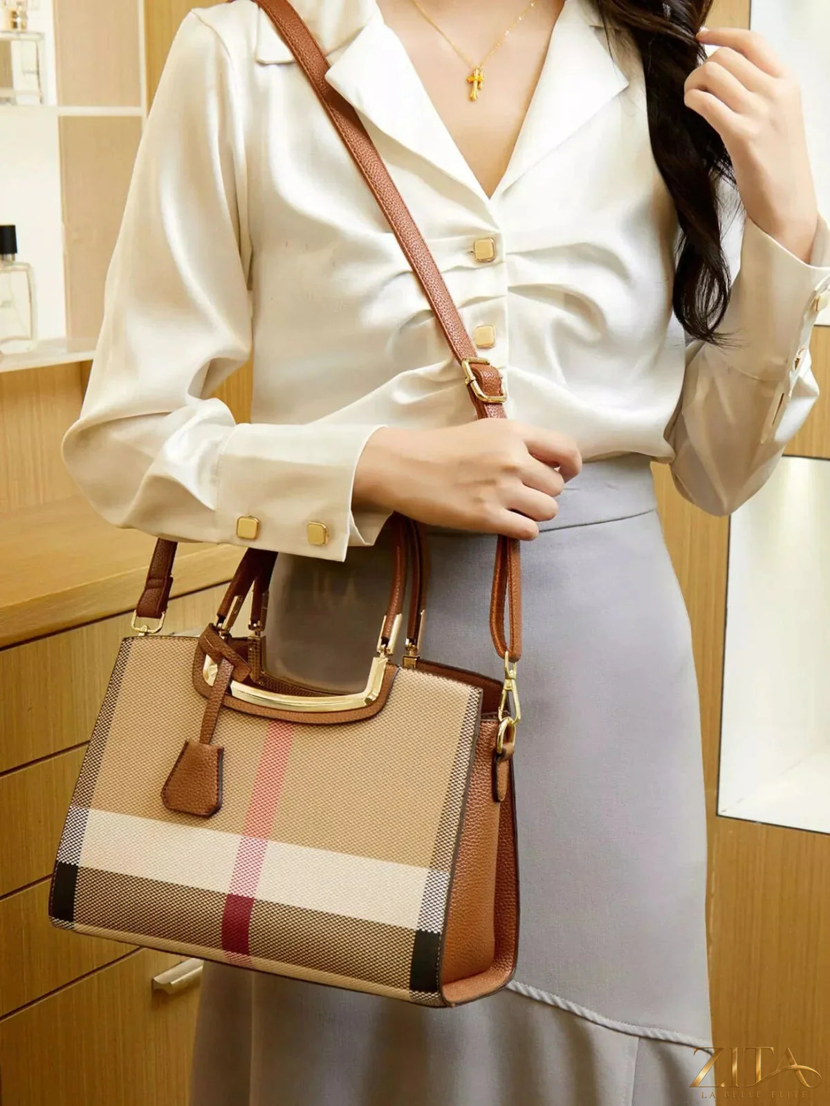 Zita La Belle Elite plaid top handle handbag with checkered pattern and structured design, featuring a short top handle and zipper closure.