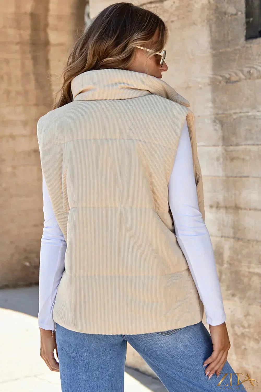 Trendsi pocketed zip-up turtleneck vest coat in black, featuring a fitted design with front pockets and a high collar.