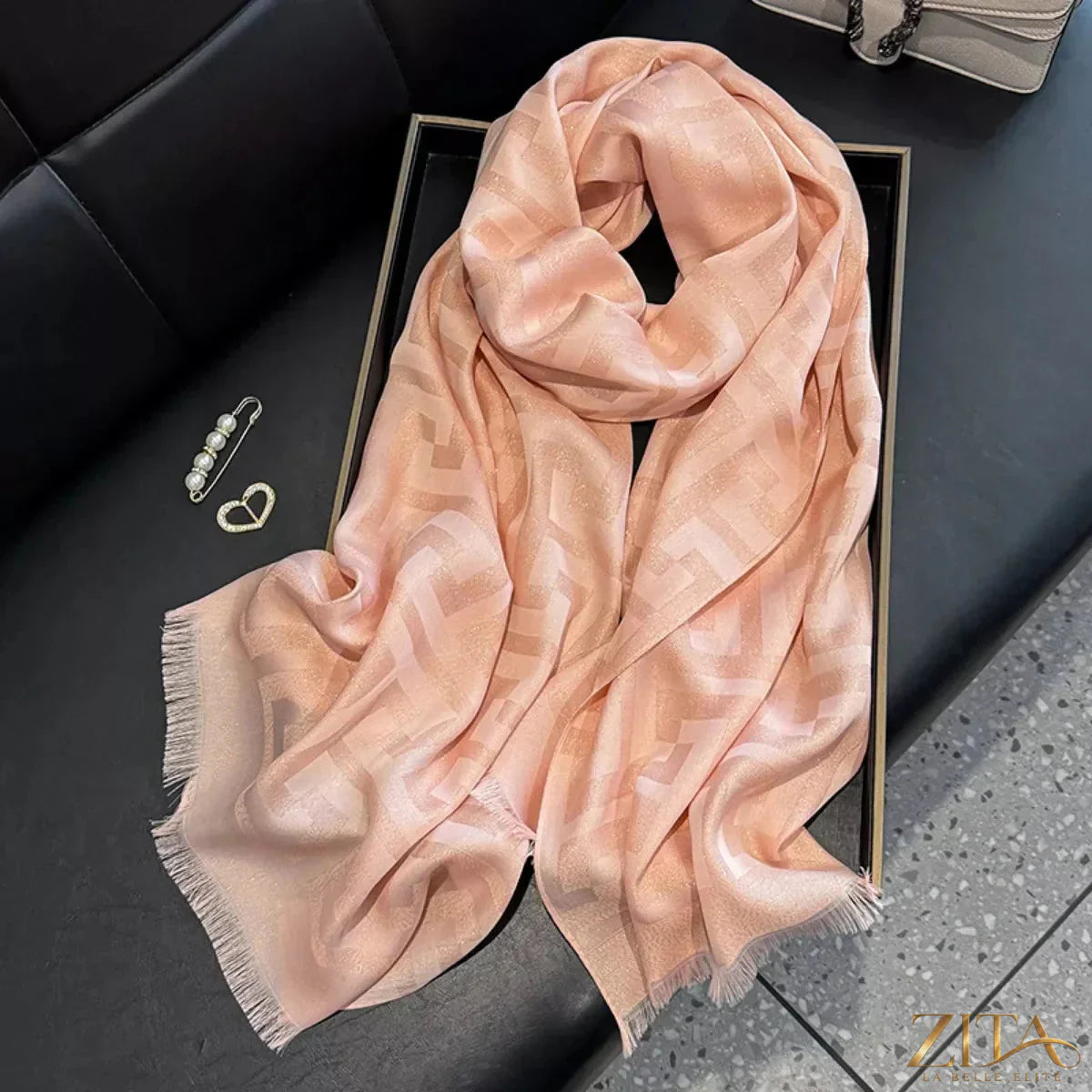 Raw hem scarf by Trendsi featuring soft fabric and fringed edges, displayed draped for a stylish, casual look.