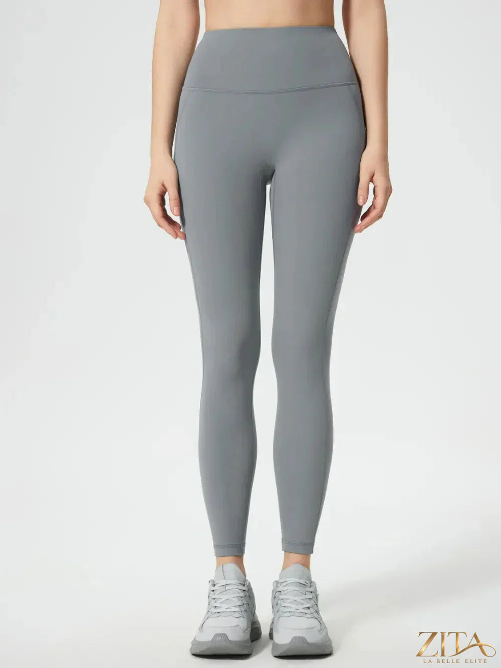 Millennia Wide Waistband Active Leggings by Trendsi, black stretchy leggings with a wide waistband for workout or casual wear.