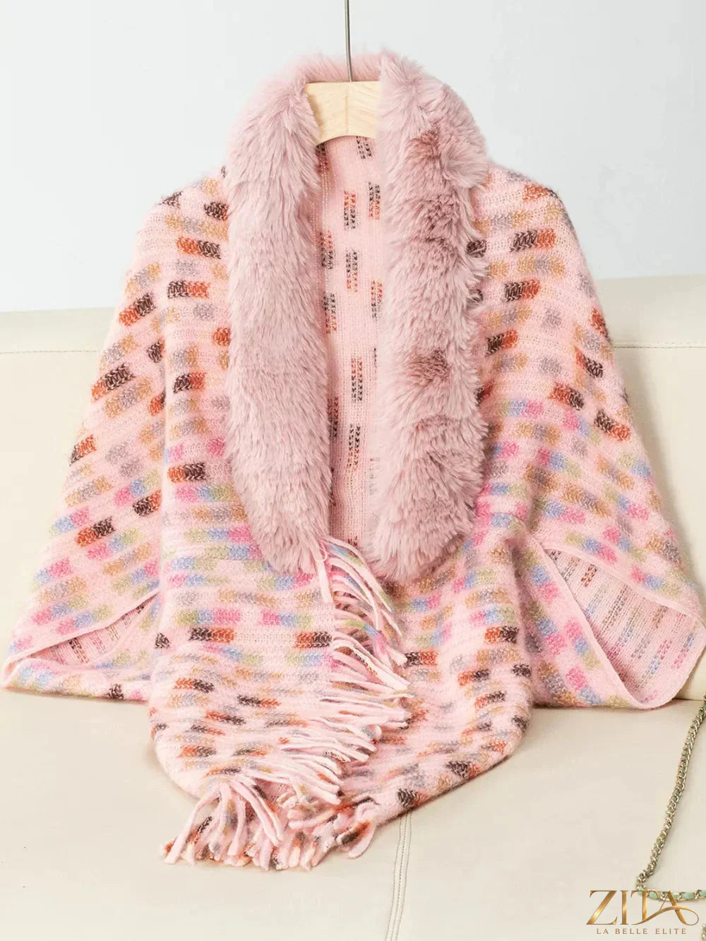 Fuzzy open front poncho with fringe trim in neutral tones, stylish and cozy women's fashion piece from Trendsi.
