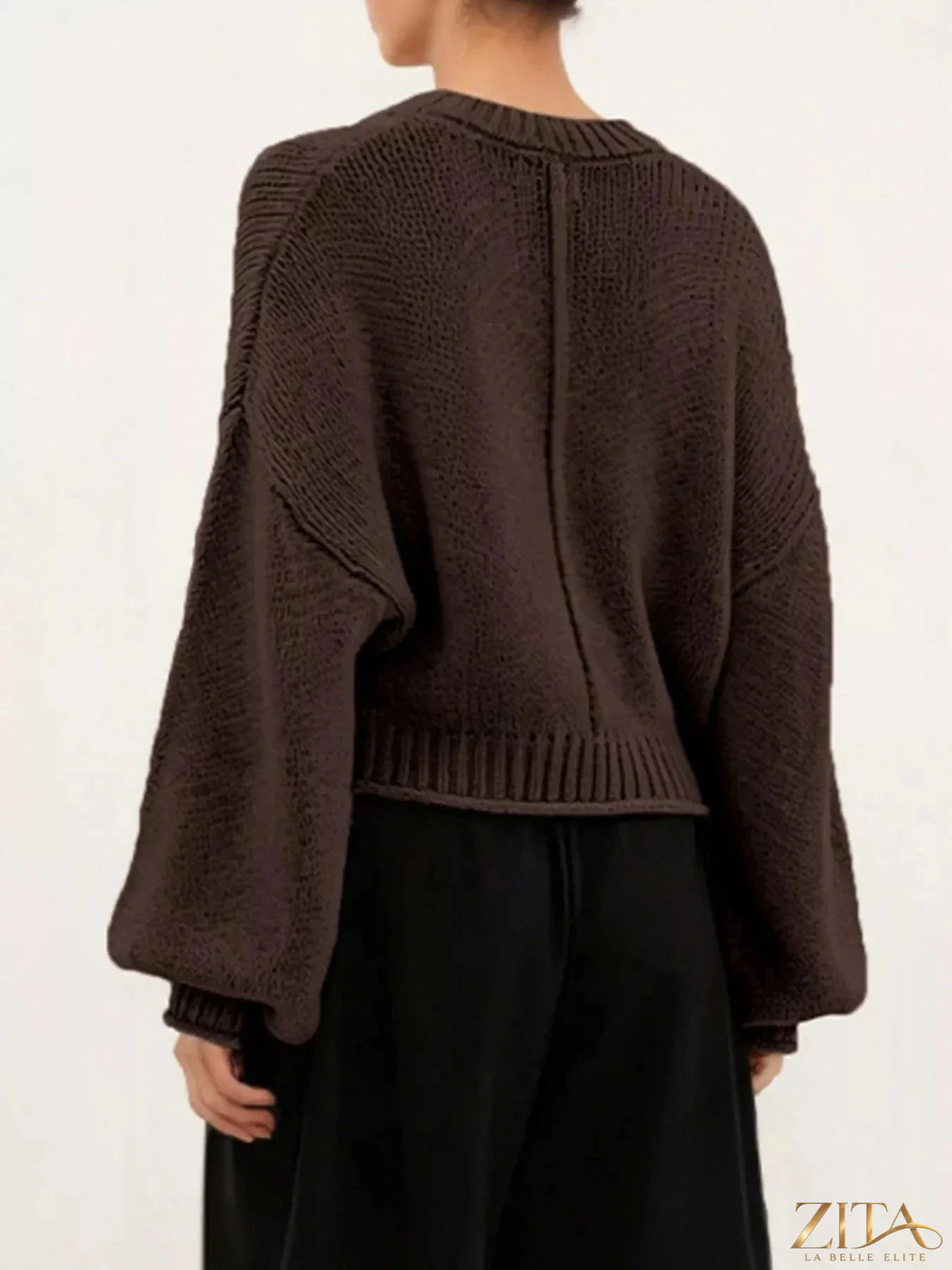 Oversized chunky knit sweater by Trendsi, featuring thick yarn and relaxed fit in neutral color, perfect for cozy casual wear.