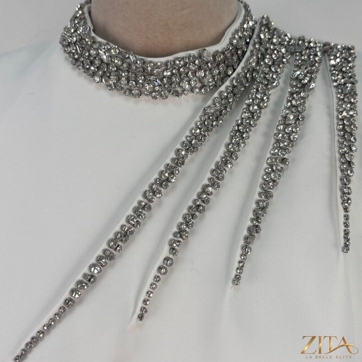 Crystal-embellished evening gown by Zita La Belle Elite, featuring intricate crystal details and elegant floor-length design.