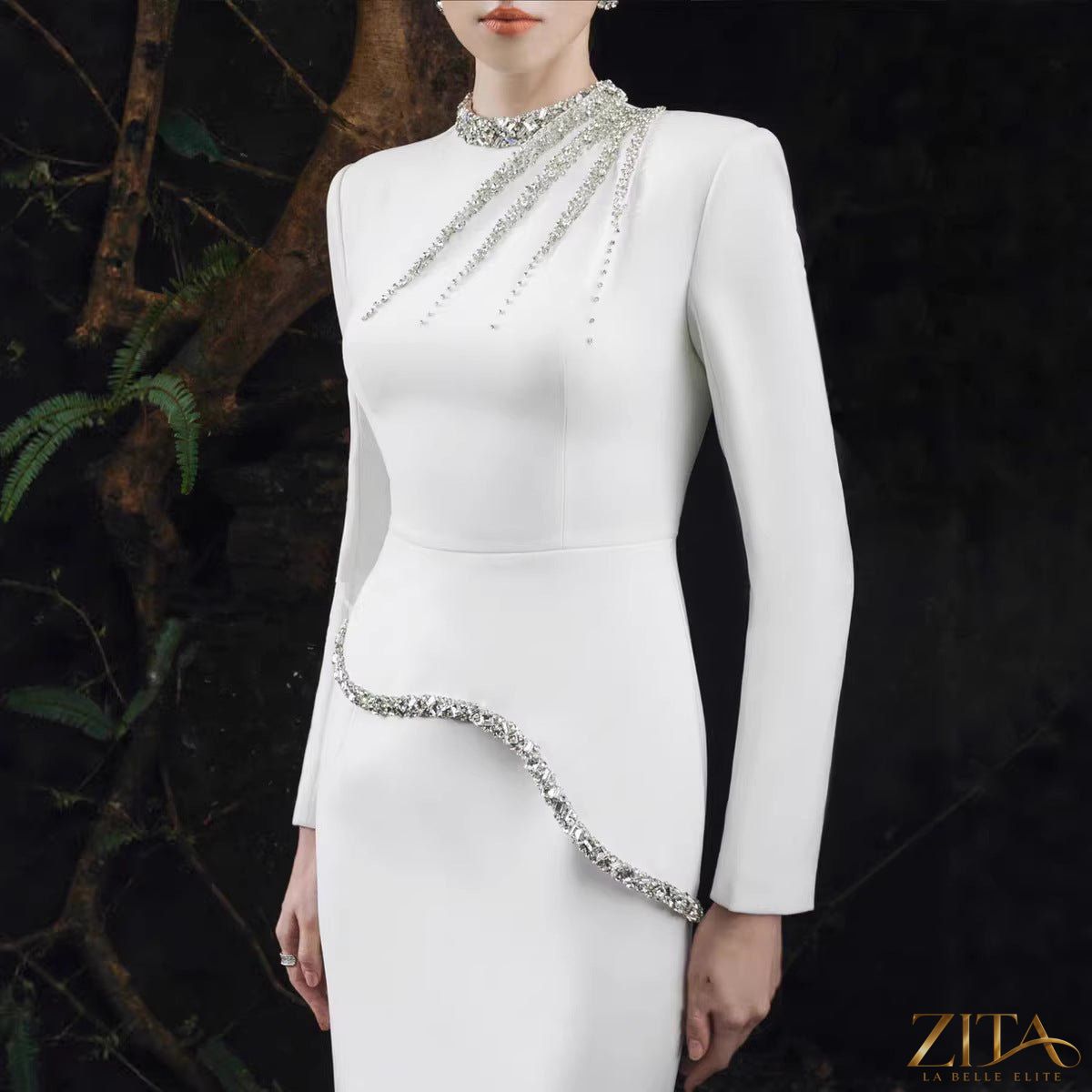 Crystal-embellished evening gown by Zita La Belle Elite featuring intricate crystal details and elegant flowing fabric.