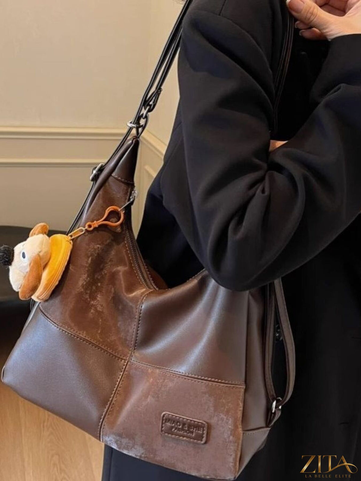 Vintage-style Zita La Belle Elite hobo shoulder bag with leather strap and textured fabric, displayed against a neutral background.