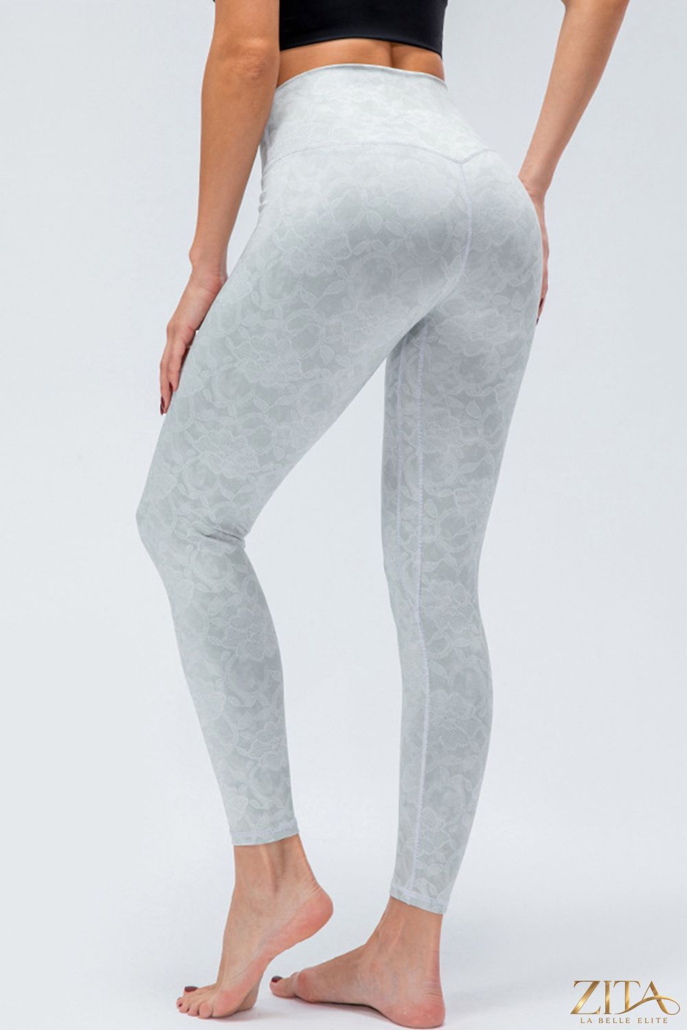 Slim fit active leggings with wide waistband, black color, shown on a model for comfortable workout or casual wear.