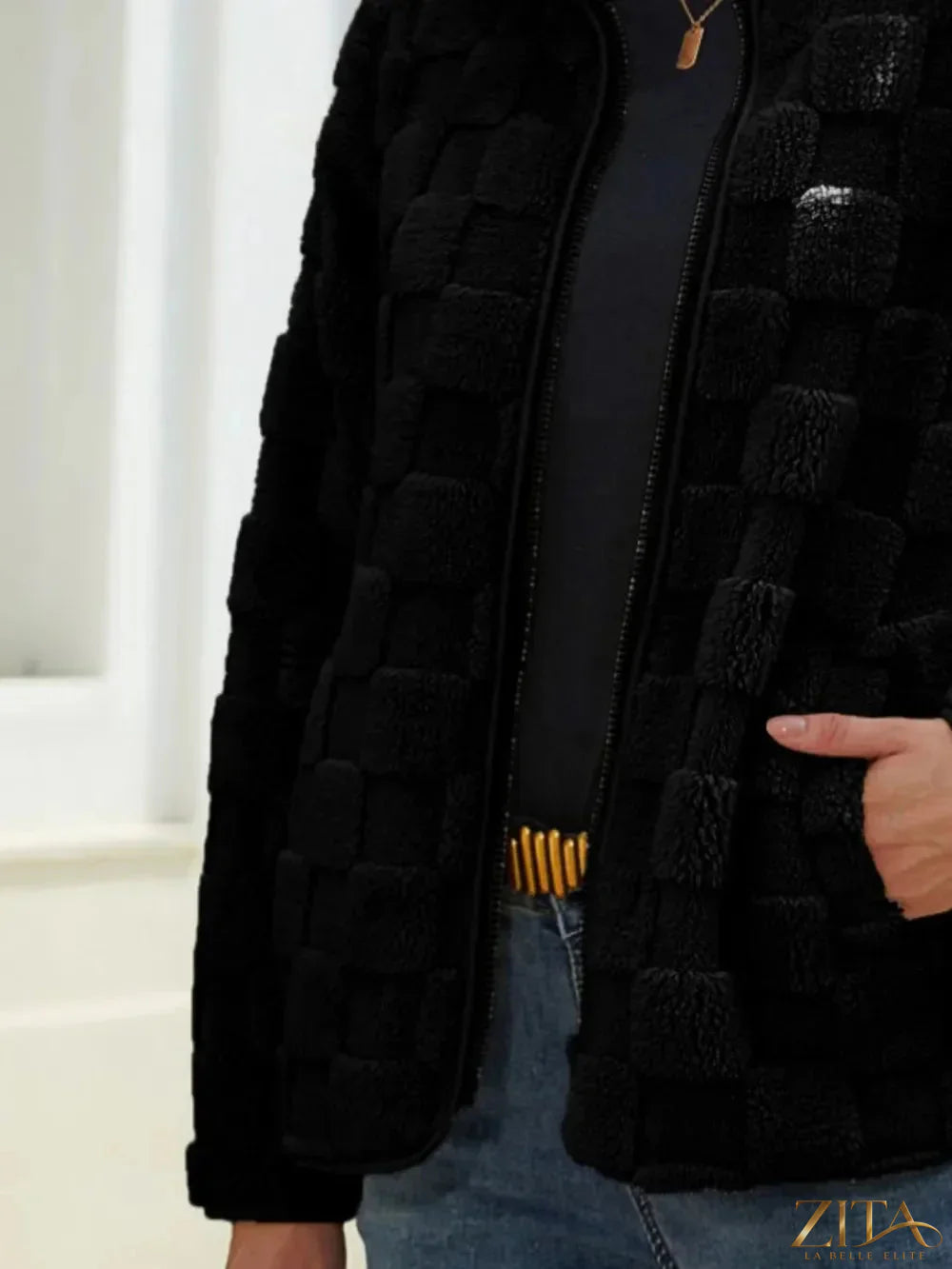 Fuzzy checkered zip-up jacket by Zita La Belle Elite, featuring a cozy, stylish design with a front zipper and checkered pattern.