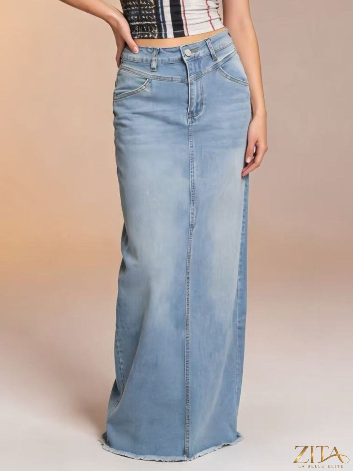 Raw hem maxi denim skirt by Zita La Belle Elite featuring a flowing fit and stylish distressed hem detail.