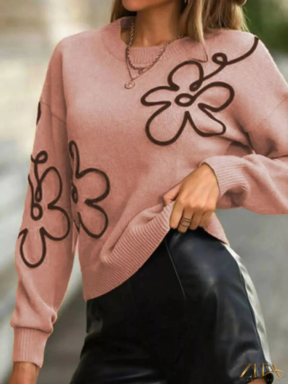Flower dropped shoulder sweater by Trendsi featuring a floral pattern and relaxed fit, showcased in a front view image.