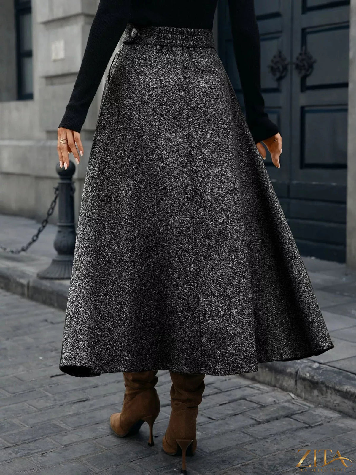 A-line midi skirt from Trendsi in soft fabric, featuring a flowy silhouette and high waist, shown on a neutral background.