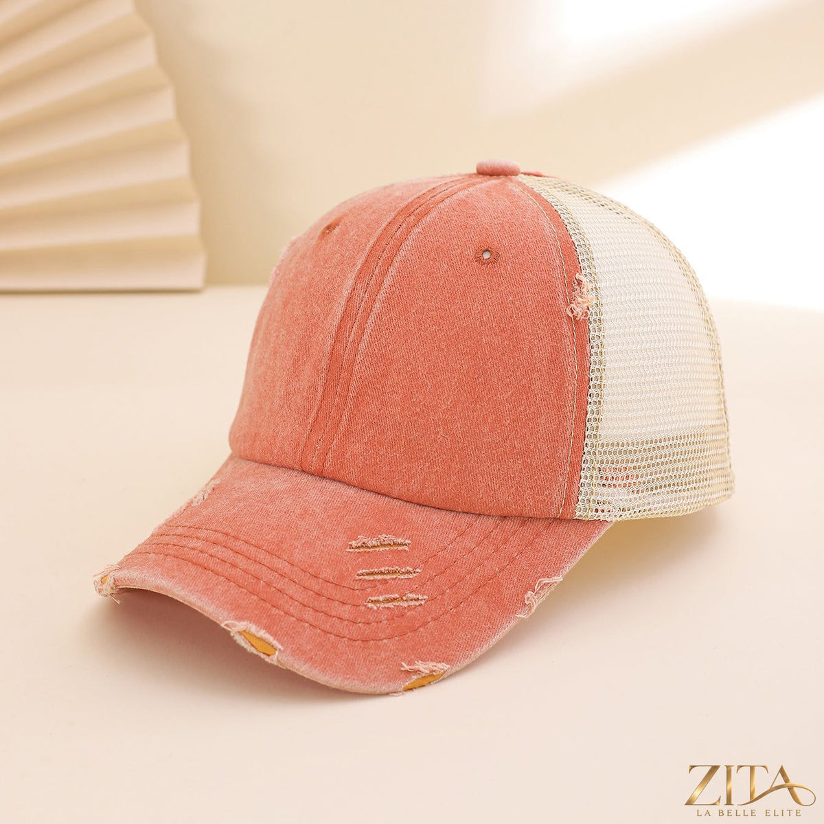 Distressed washed mesh baseball cap by Zita La Belle Elite, showcasing a casual, worn-in style with breathable mesh panels.