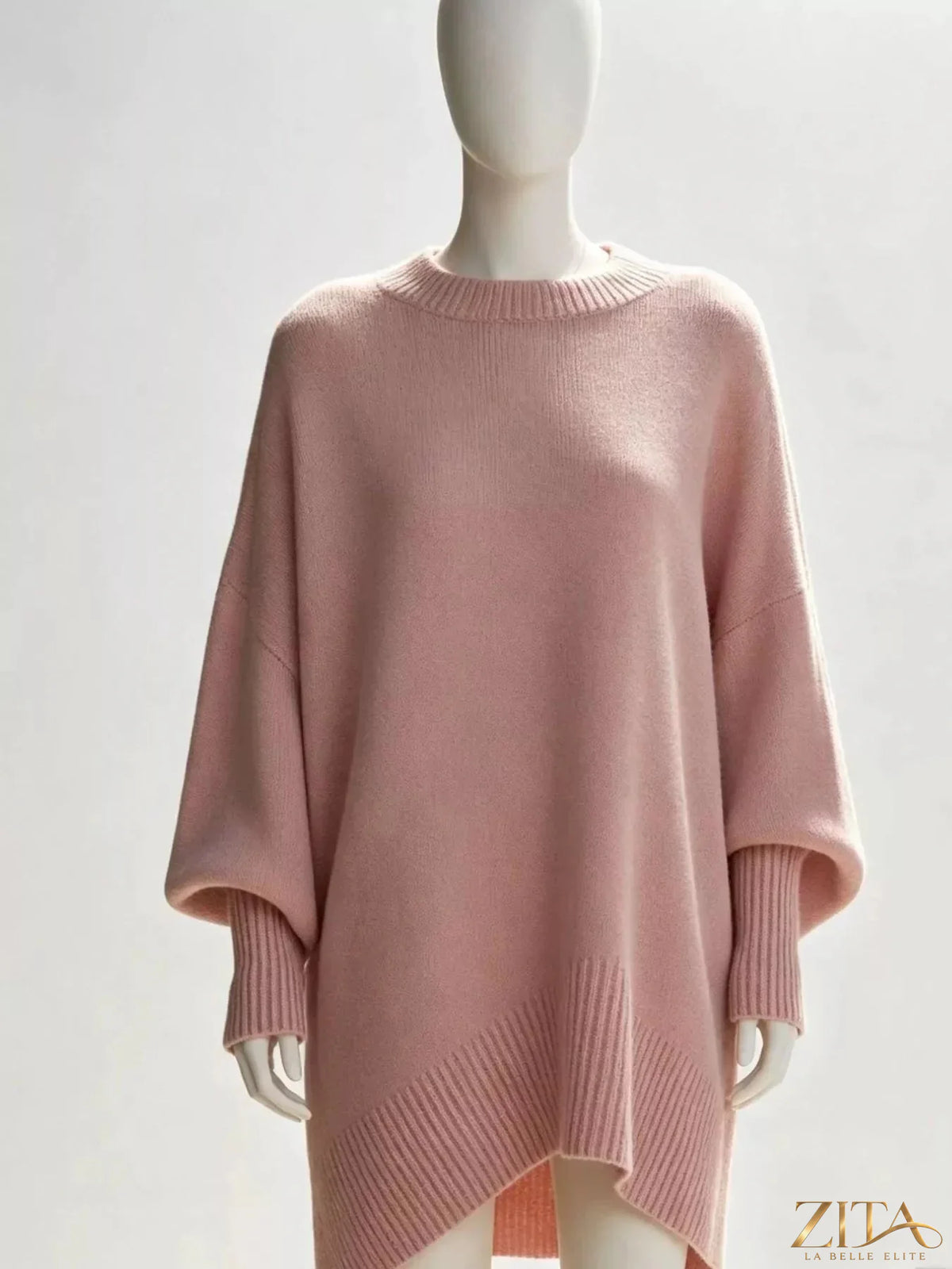 Oversized dropped shoulder sweater by Trendsi, soft knit fabric, relaxed fit, and casual style, shown in a neutral color.
