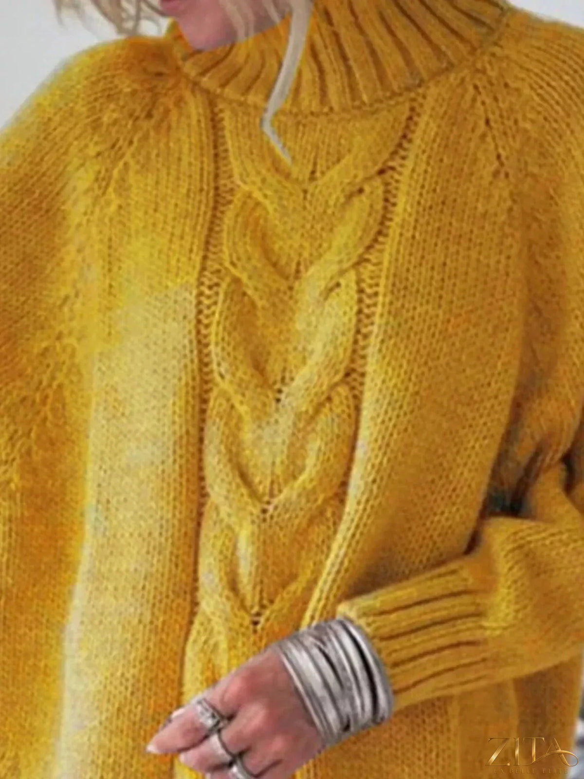 Zita La Belle Elite cable-knit long sleeve sweater in cozy, textured knit with a relaxed fit and ribbed cuffs.