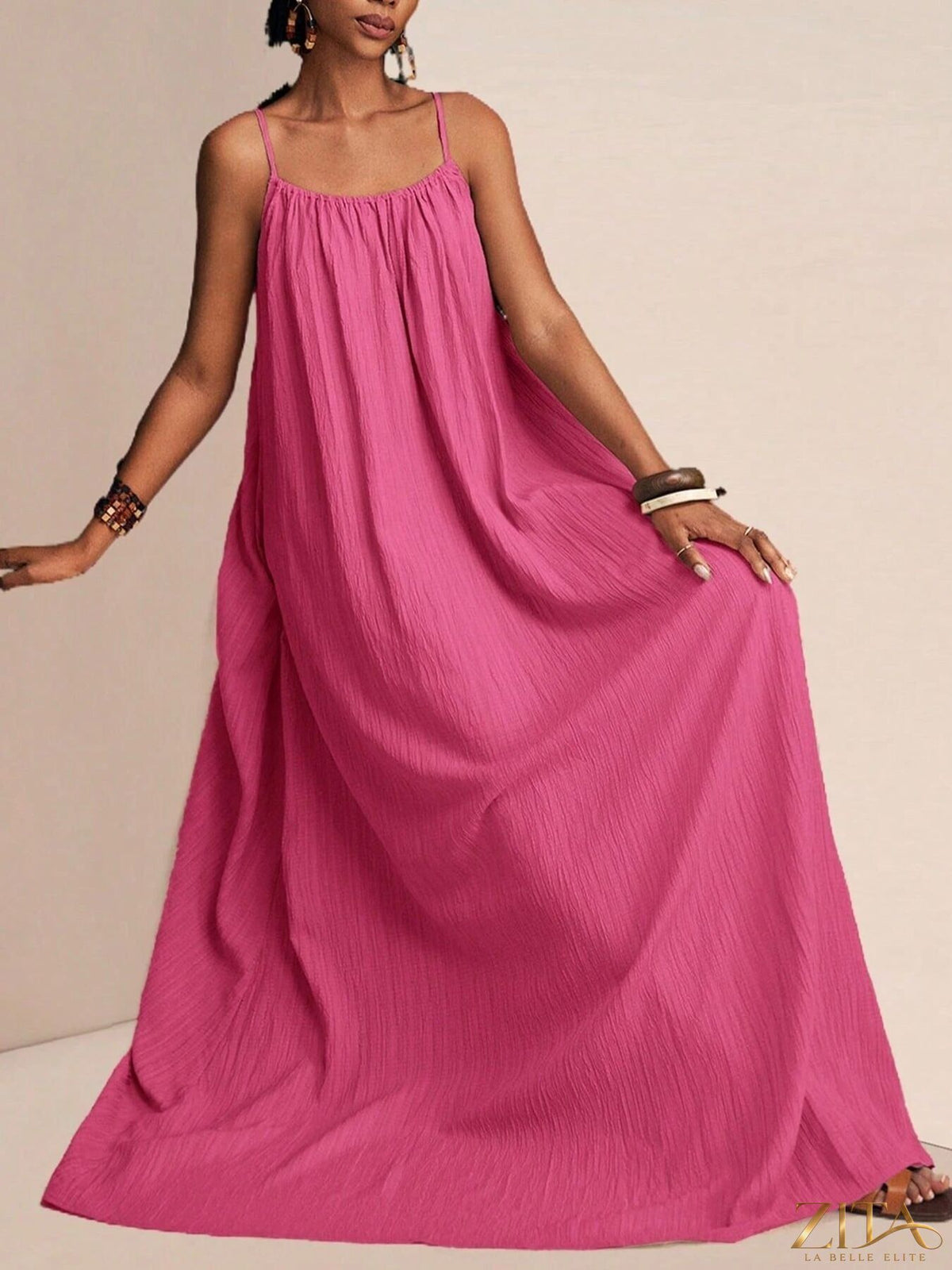 Flowy maxi dress by Zita La Belle Elite featuring spaghetti straps and a breezy, lightweight fabric perfect for summer wear.