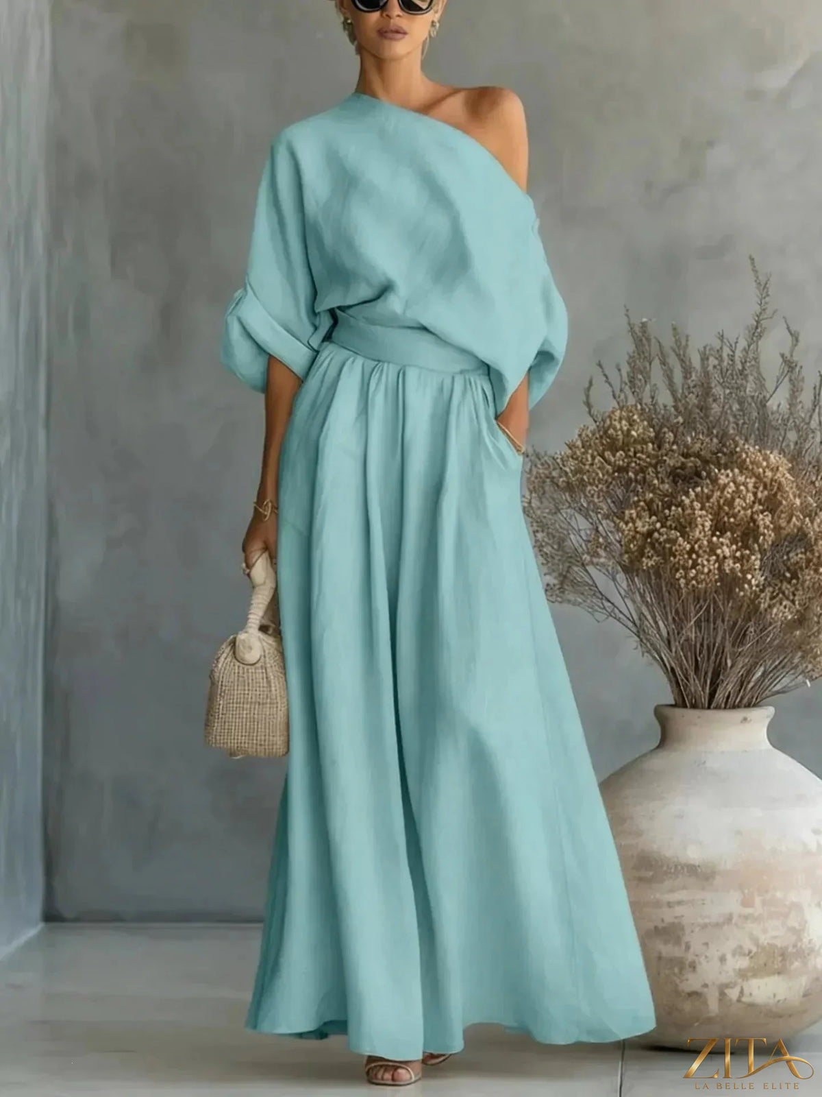 Plus size Zita La Belle Elite one-shoulder top and wide-leg pants set, showcasing the stylish, coordinated outfit on a model.