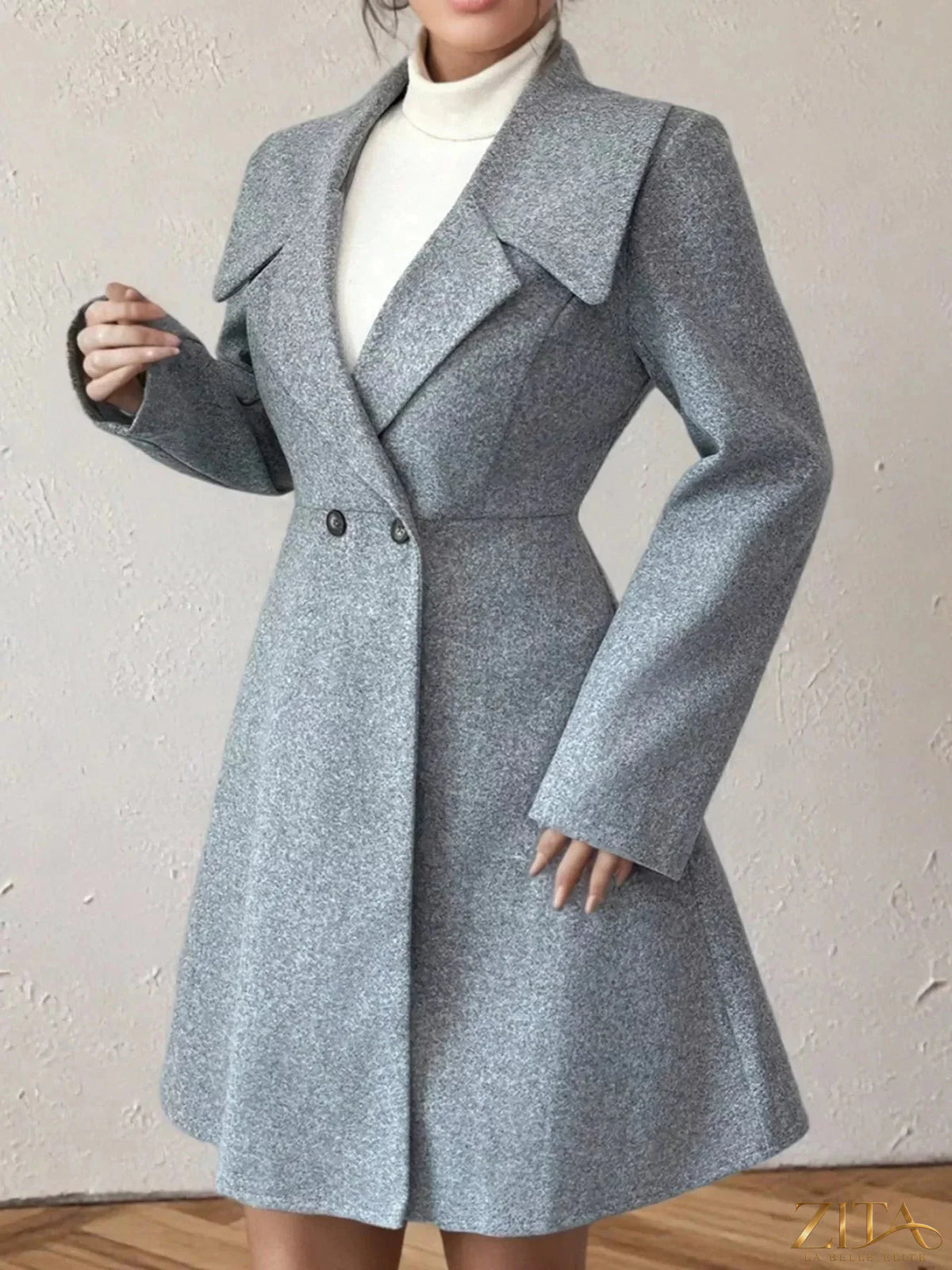 Zita La Belle Elite double-breasted wool blend coat with wide lapels and button details on a hanger.
