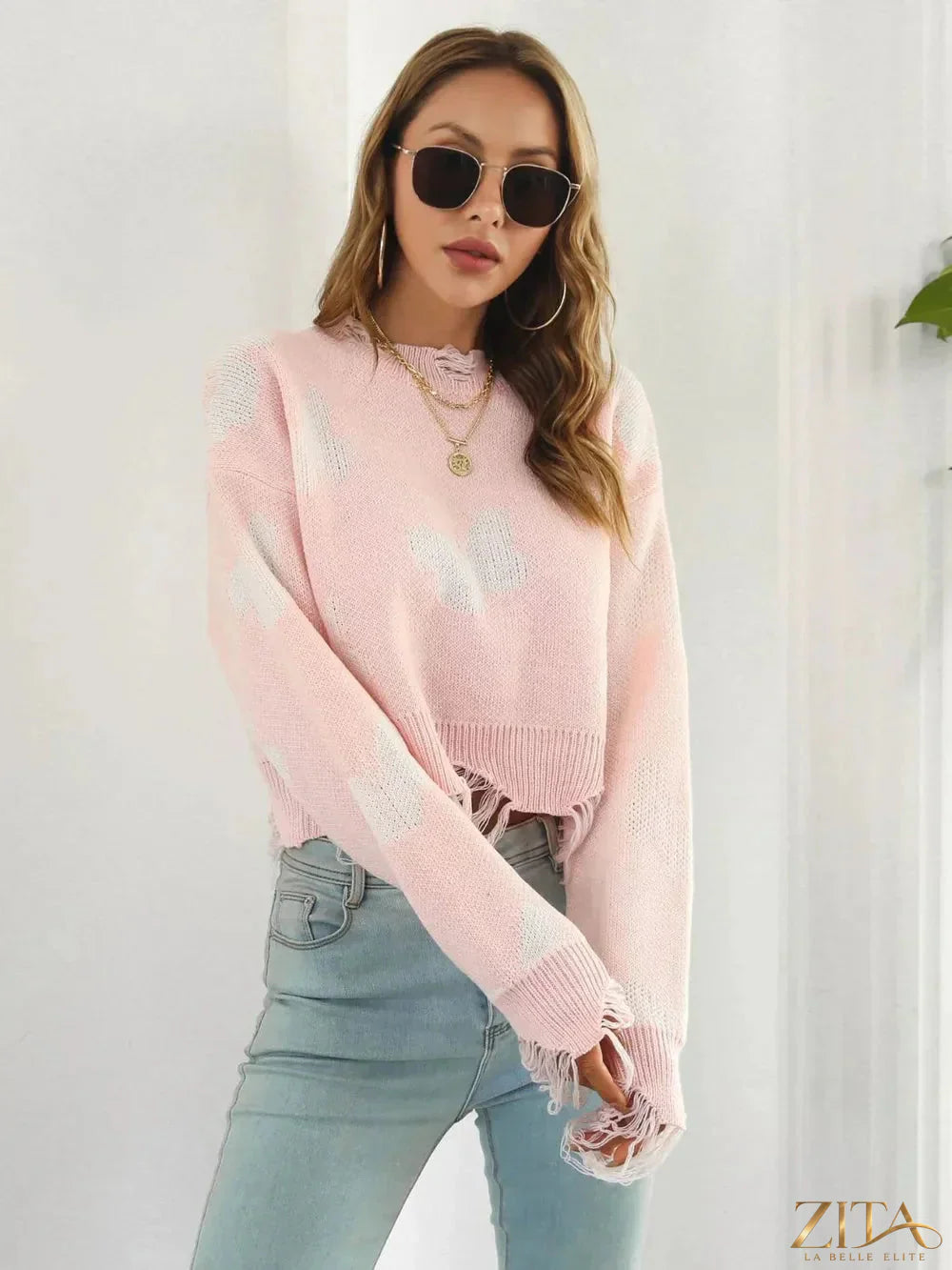 Zita La Belle Elite distressed butterfly cropped sweater featuring a worn-in look, ribbed cuffs, and butterfly knit pattern.