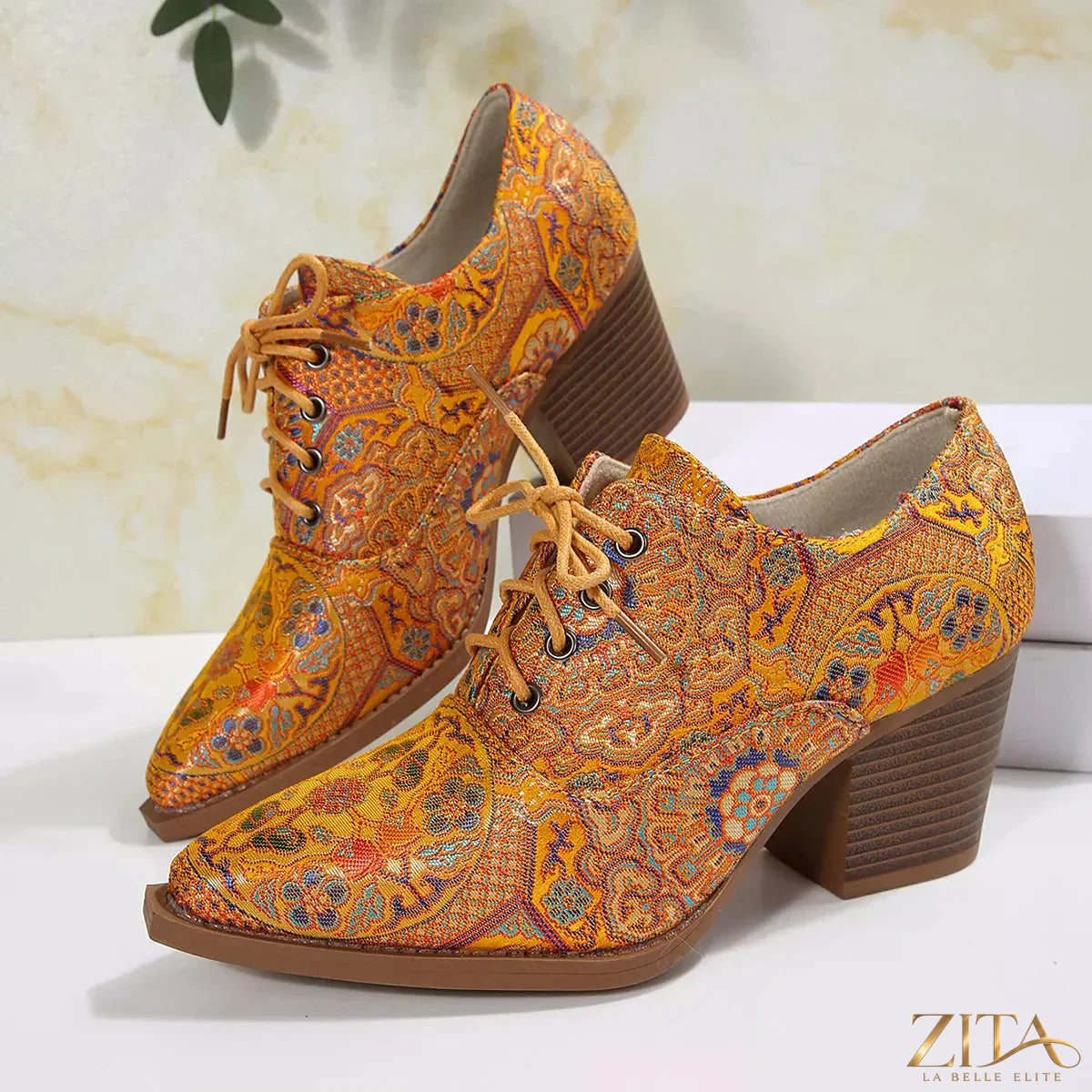 Zita La Belle Elite point toe block heel ankle boots showing sleek black leather with ankle height and stylish design.