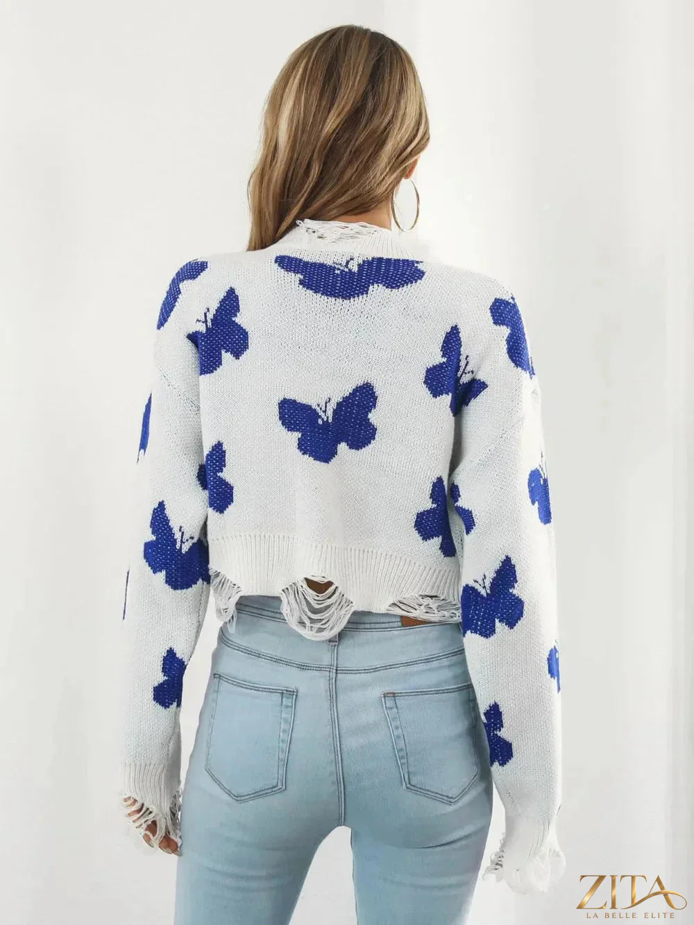 Zita La Belle Elite distressed butterfly cropped sweater in soft fabric with ripped details and a relaxed fit.
