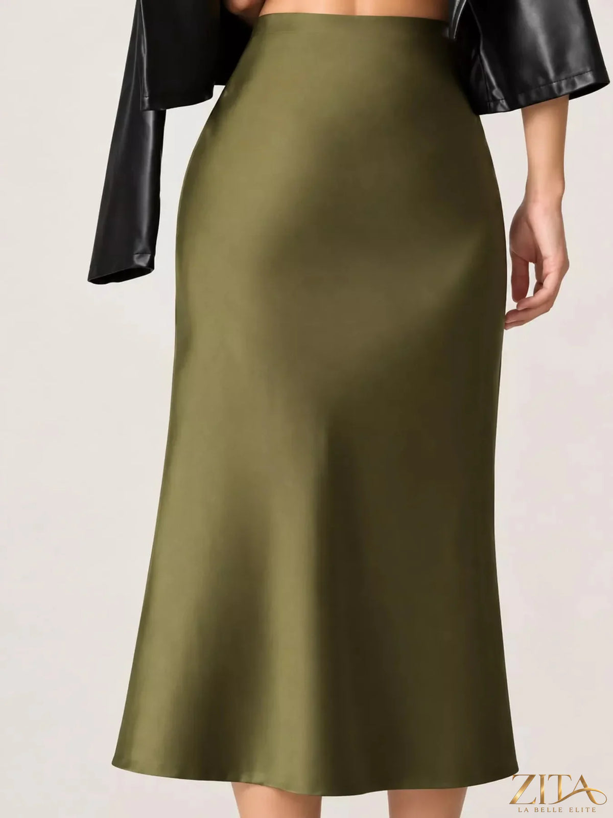 High-waisted satin midi skirt in a smooth, shiny fabric with a flowy silhouette, styled in a neutral color.