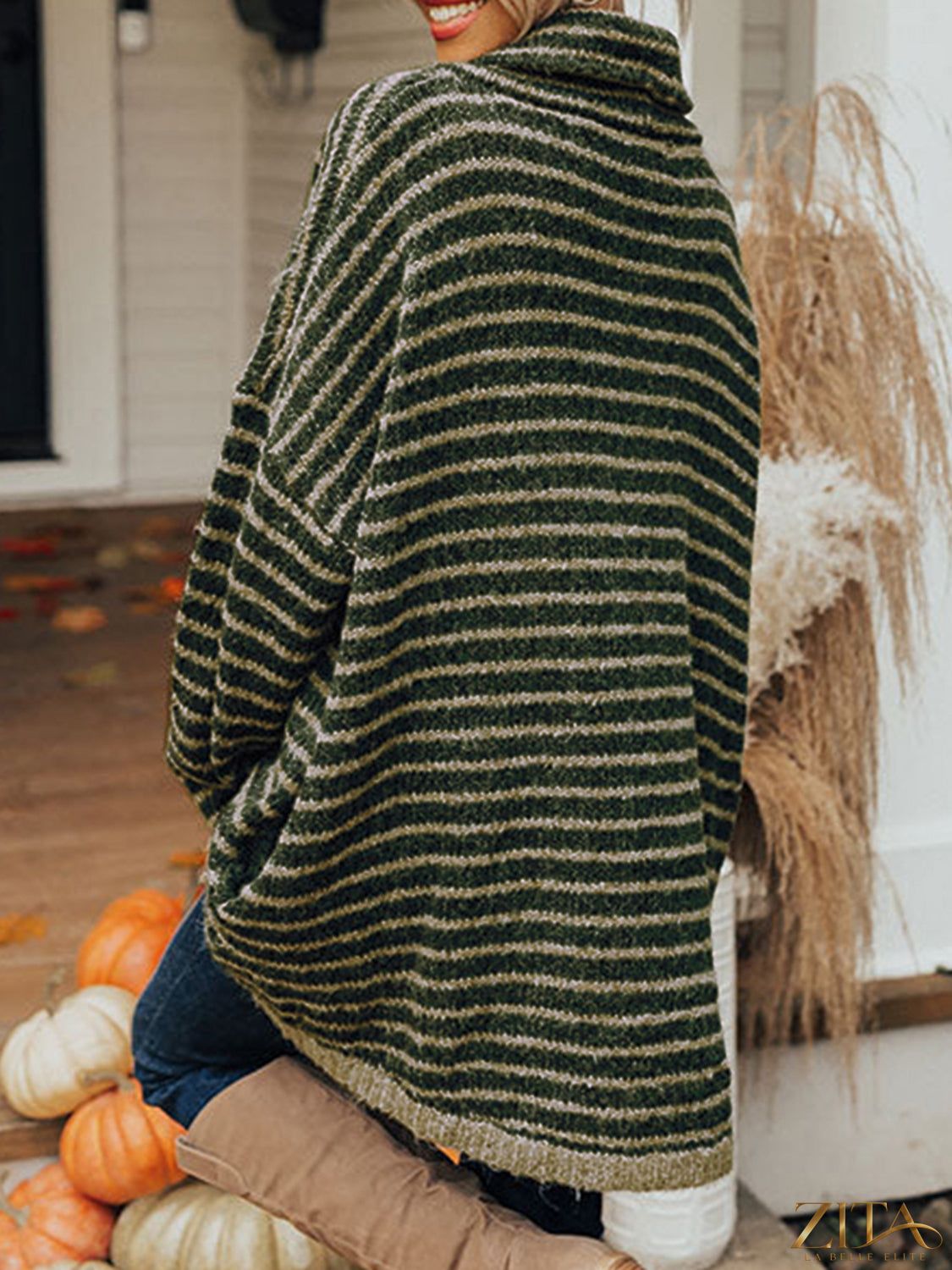 Zita La Belle Elite striped turtleneck sweater with front pockets, cozy knit design, featuring black and white horizontal stripes.