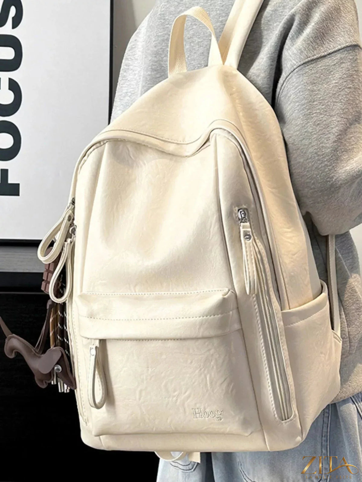 Leather texture backpack bag by Trendsi, featuring a stylish design with sturdy straps and a spacious main compartment.