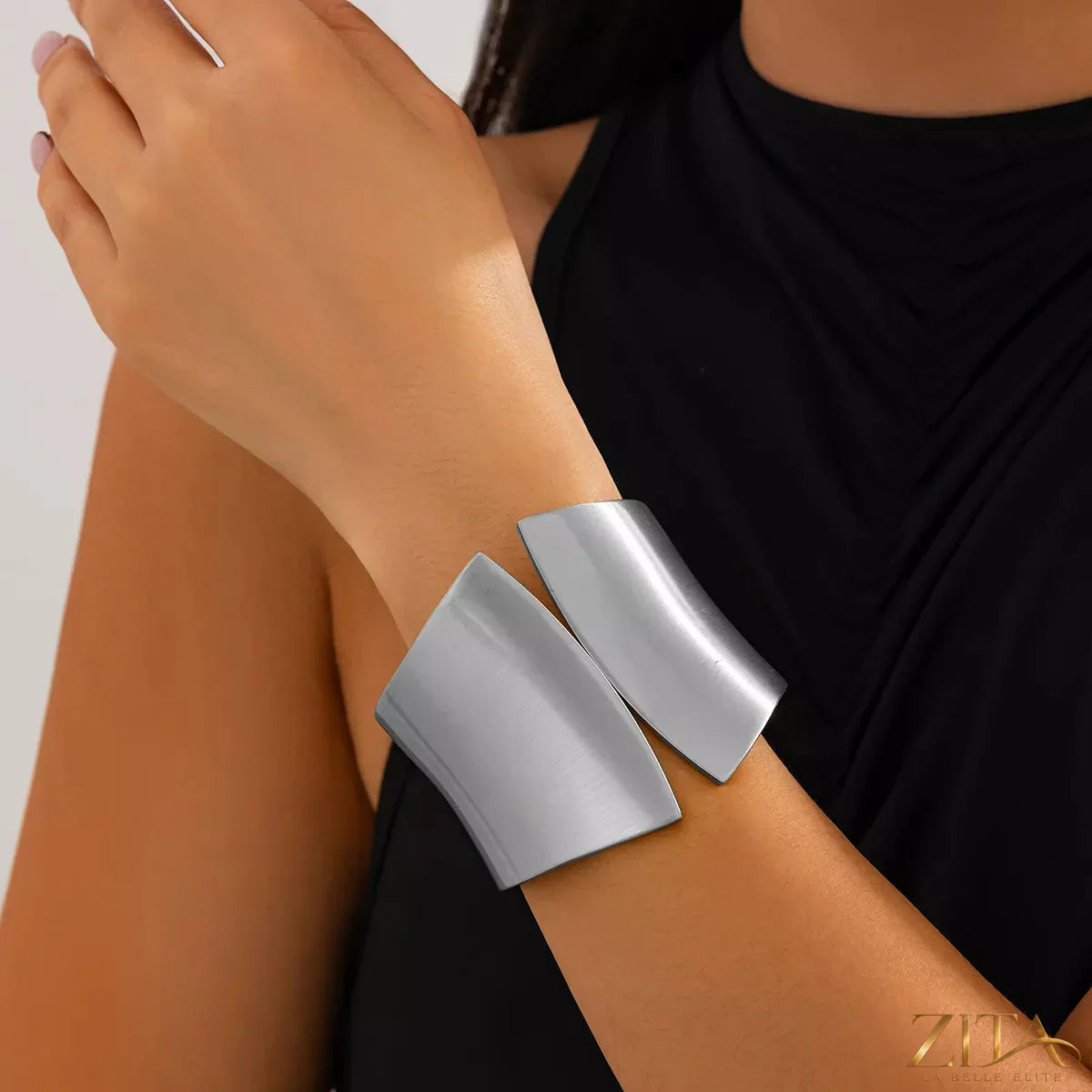 Zita La Belle Elite wide cuff bracelet featuring sleek metal design and contemporary style, worn on a wrist.