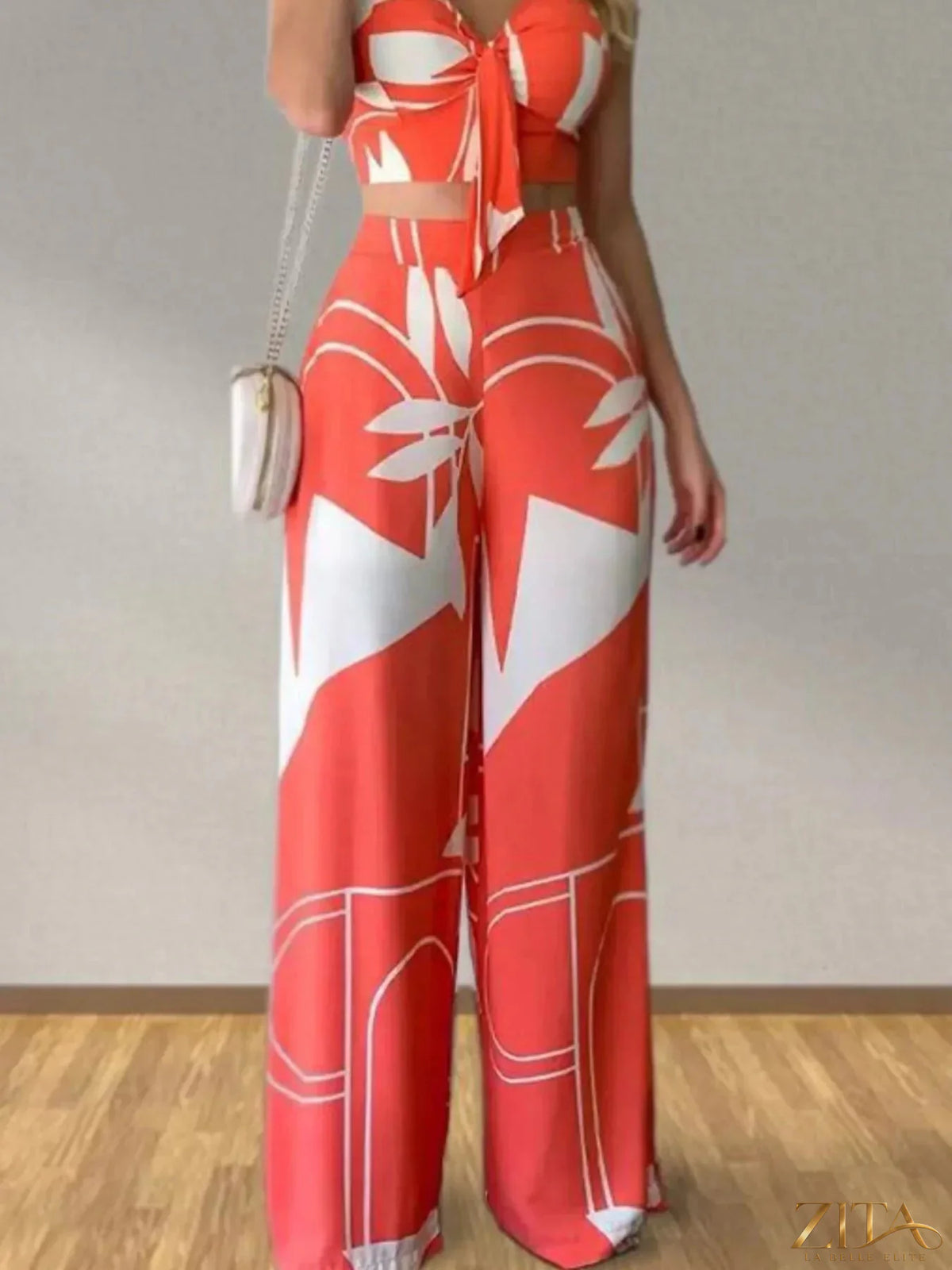 Zita La Belle Elite tropical print spaghetti strap crop top and wide-leg pants set, featuring vibrant floral patterns and comfortable fit.